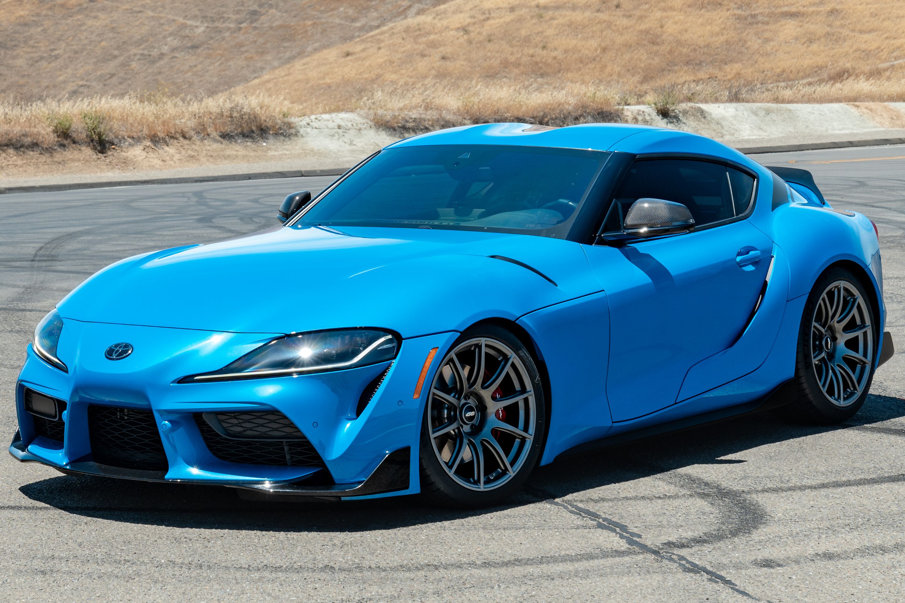 Blue Toyota GR Supra with 19" SM-10 Apex wheels in Anthracite
