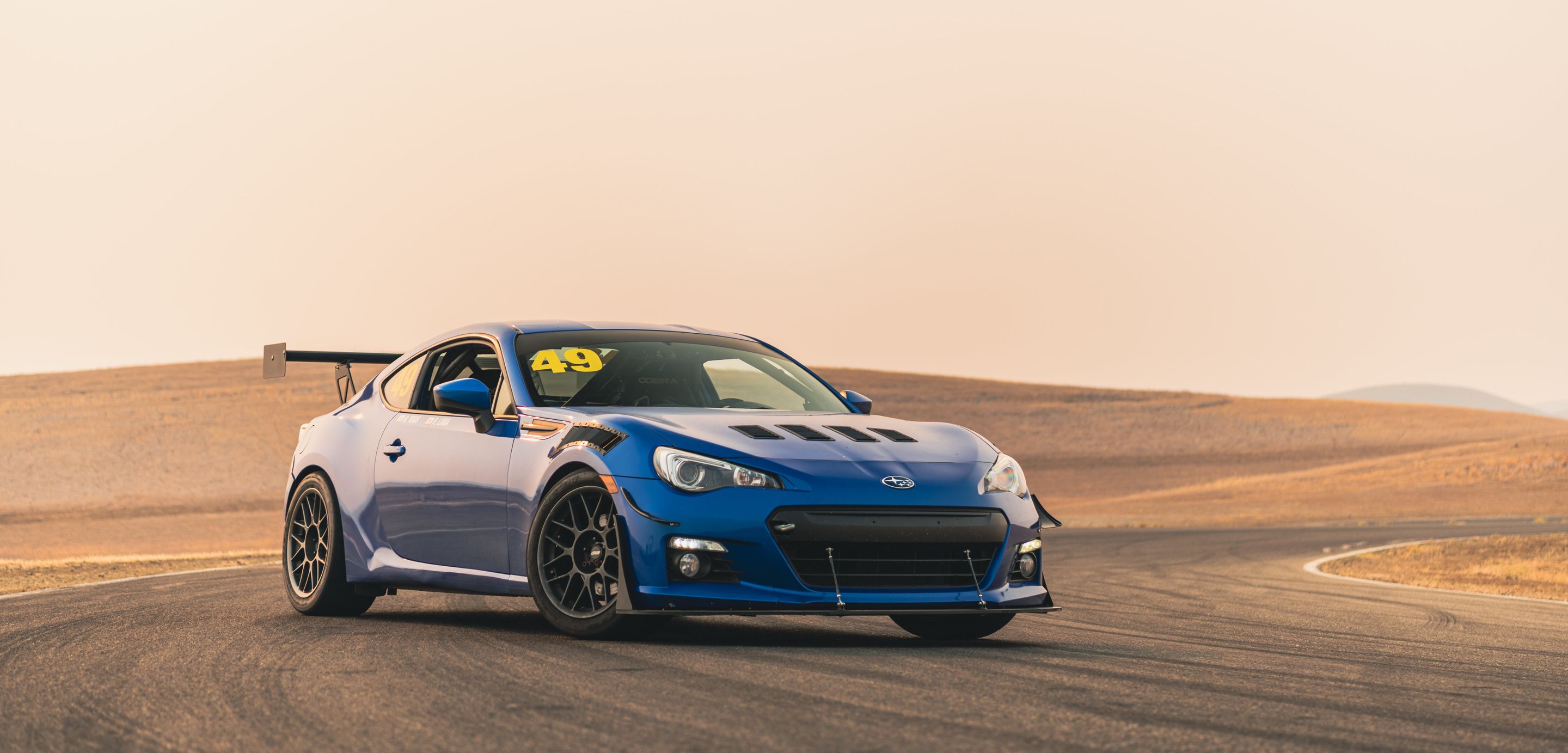 Blue Subaru ZC6 / Gen 1 BRZ with 17" ARC-8 Apex wheels in Anthracite