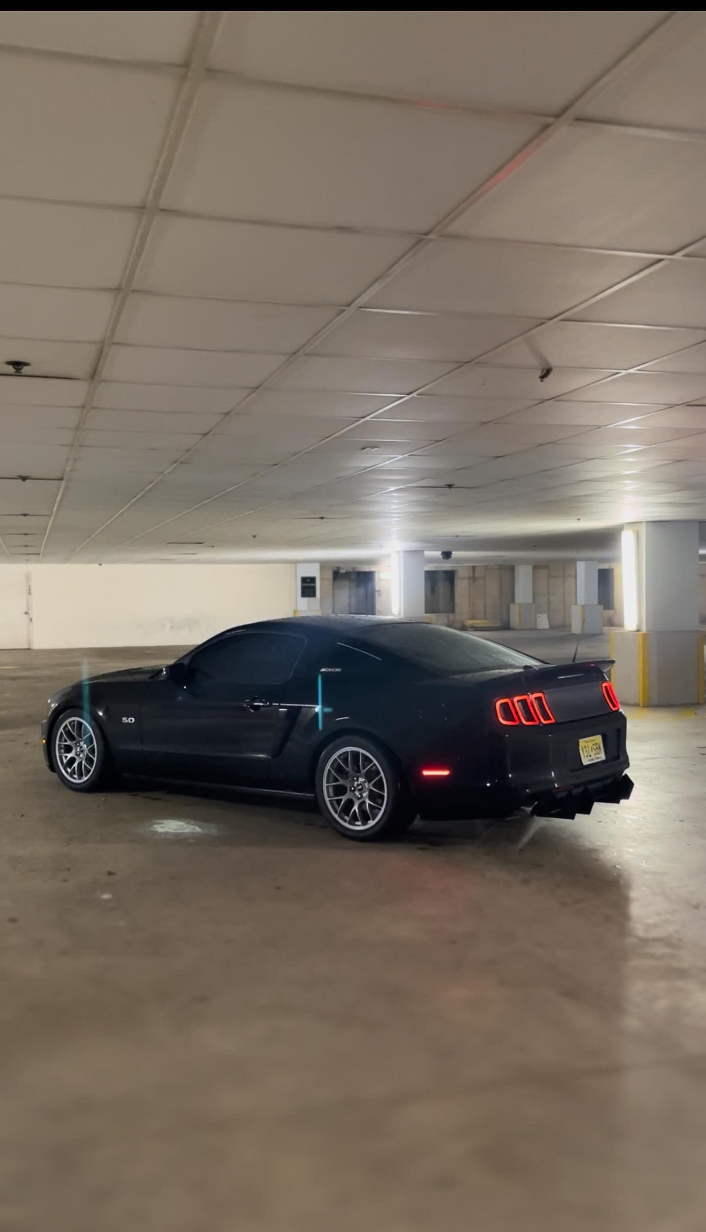 Black Ford S197 Mustang GT with 18" EC-7 Apex wheels in Race Silver