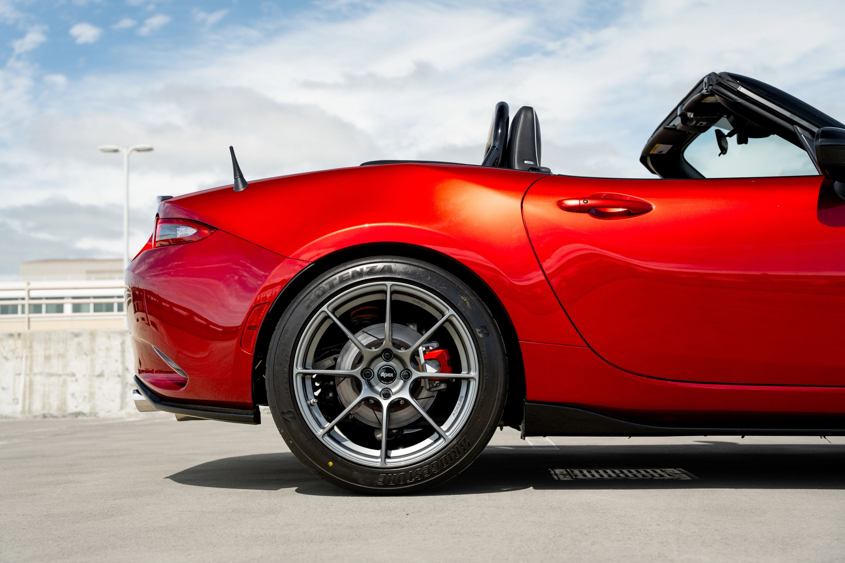 Red Mazda ND MX-5 Miata with 17" SM-8RS Apex wheels in Anthracite