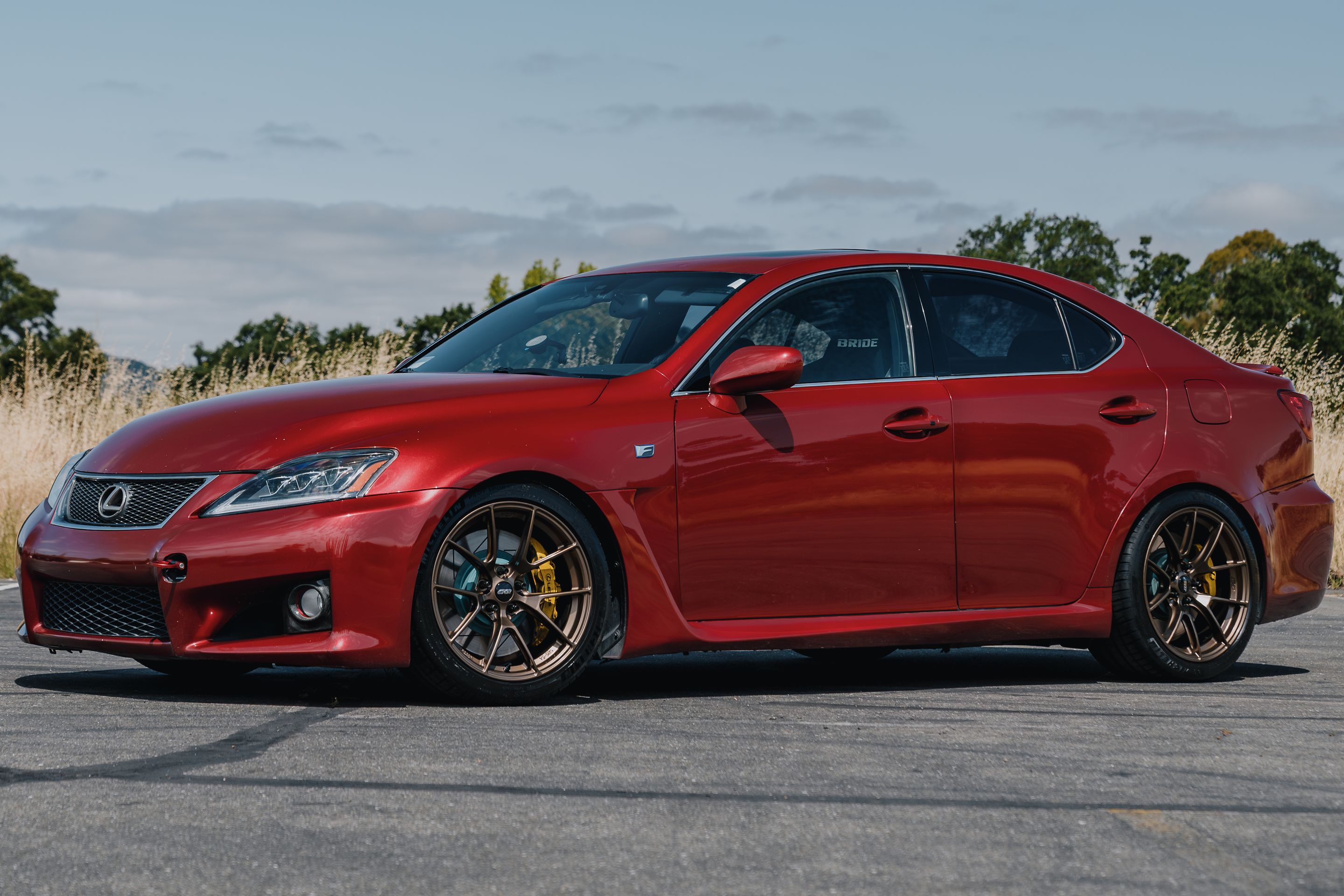 Red Lexus USE20 IS-F with 18" VS-5RS Apex wheels in Satin Bronze