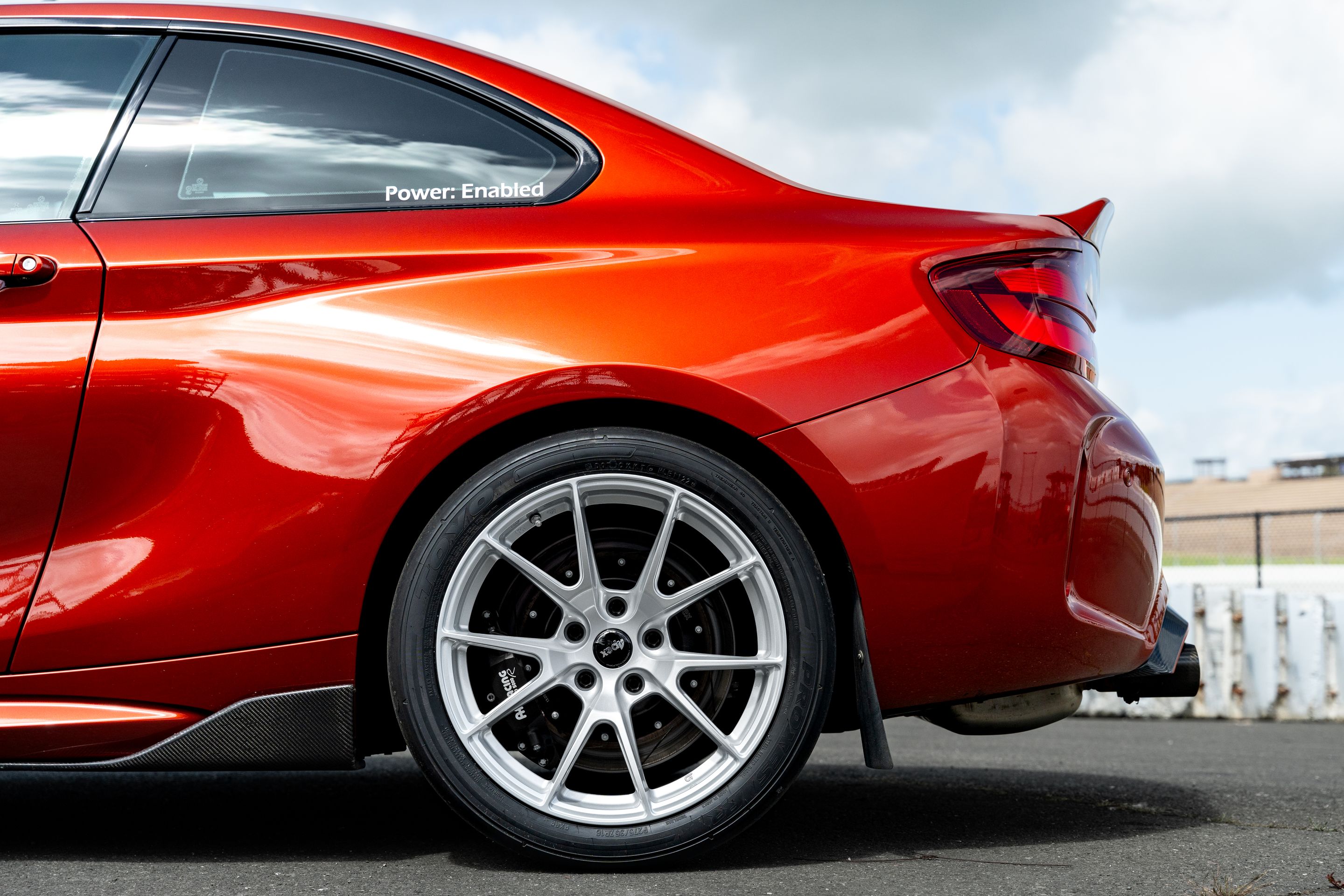 Orange BMW F87 M2 with 18" VS-5 Apex wheels in Race Silver