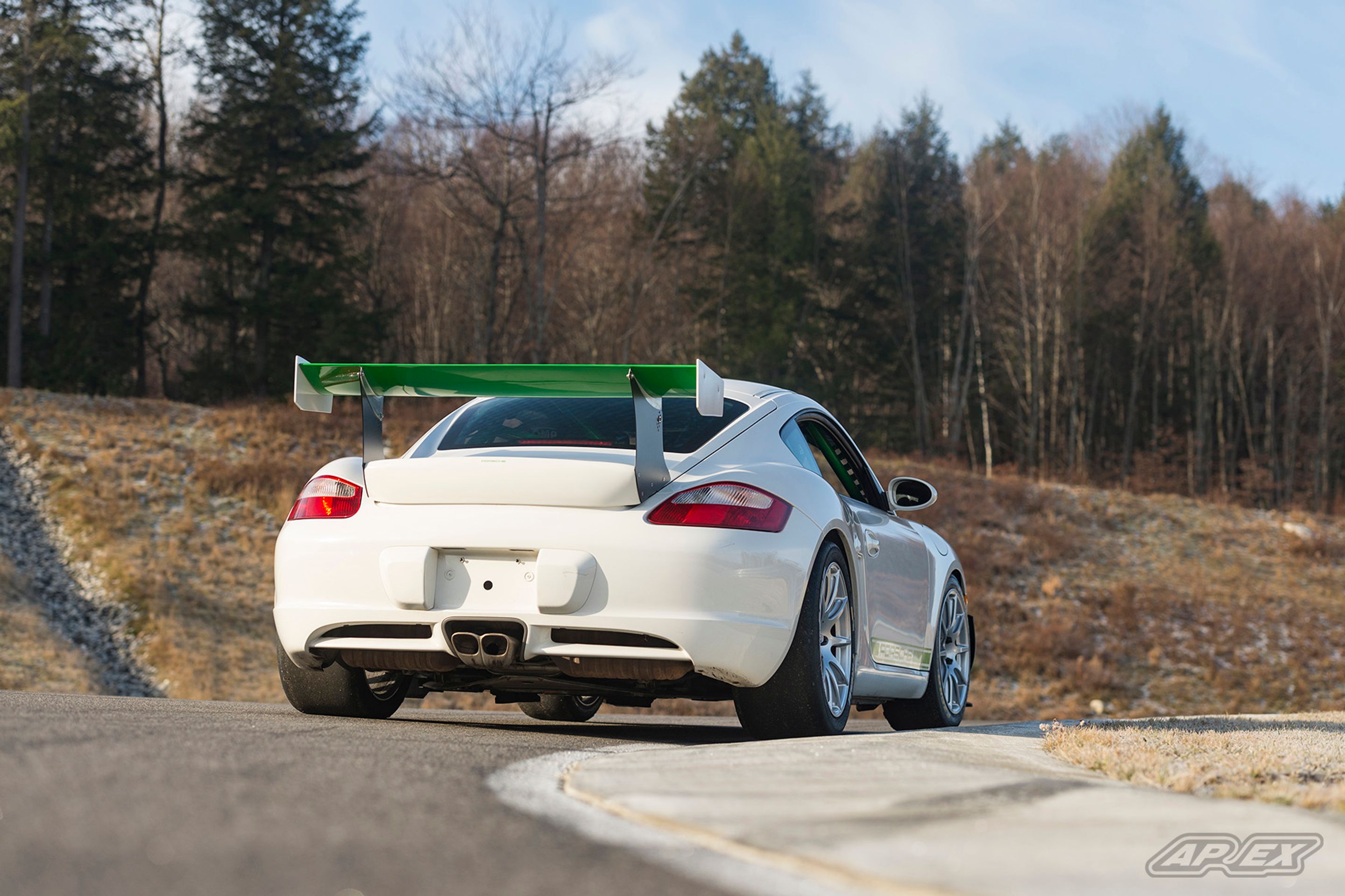 White Porsche 987 Cayman S with 18" SM-10 Apex wheels in Race Silver