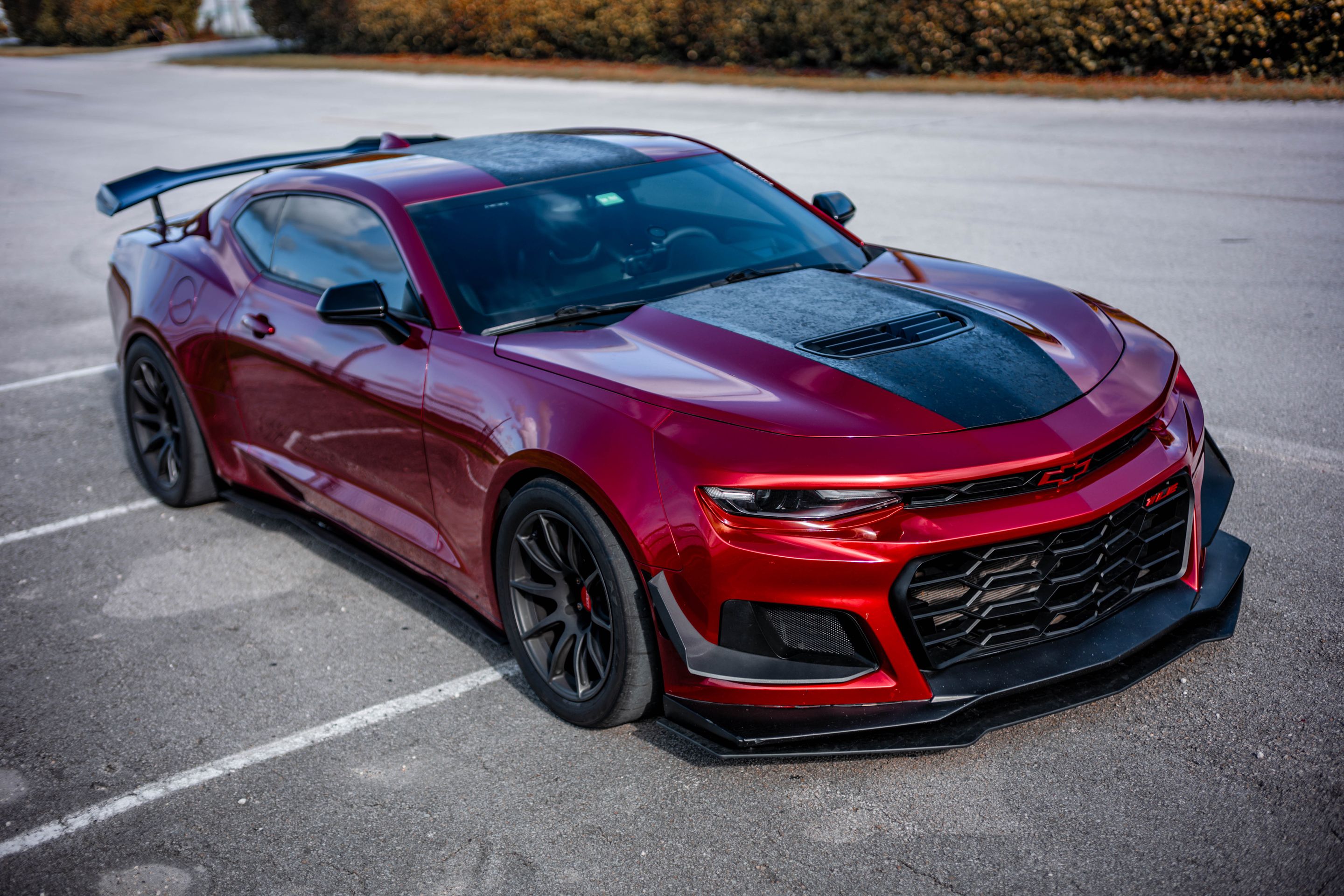 Red Chevrolet 6th Gen Camaro SS with 19" SM-10 Apex wheels in Satin Black