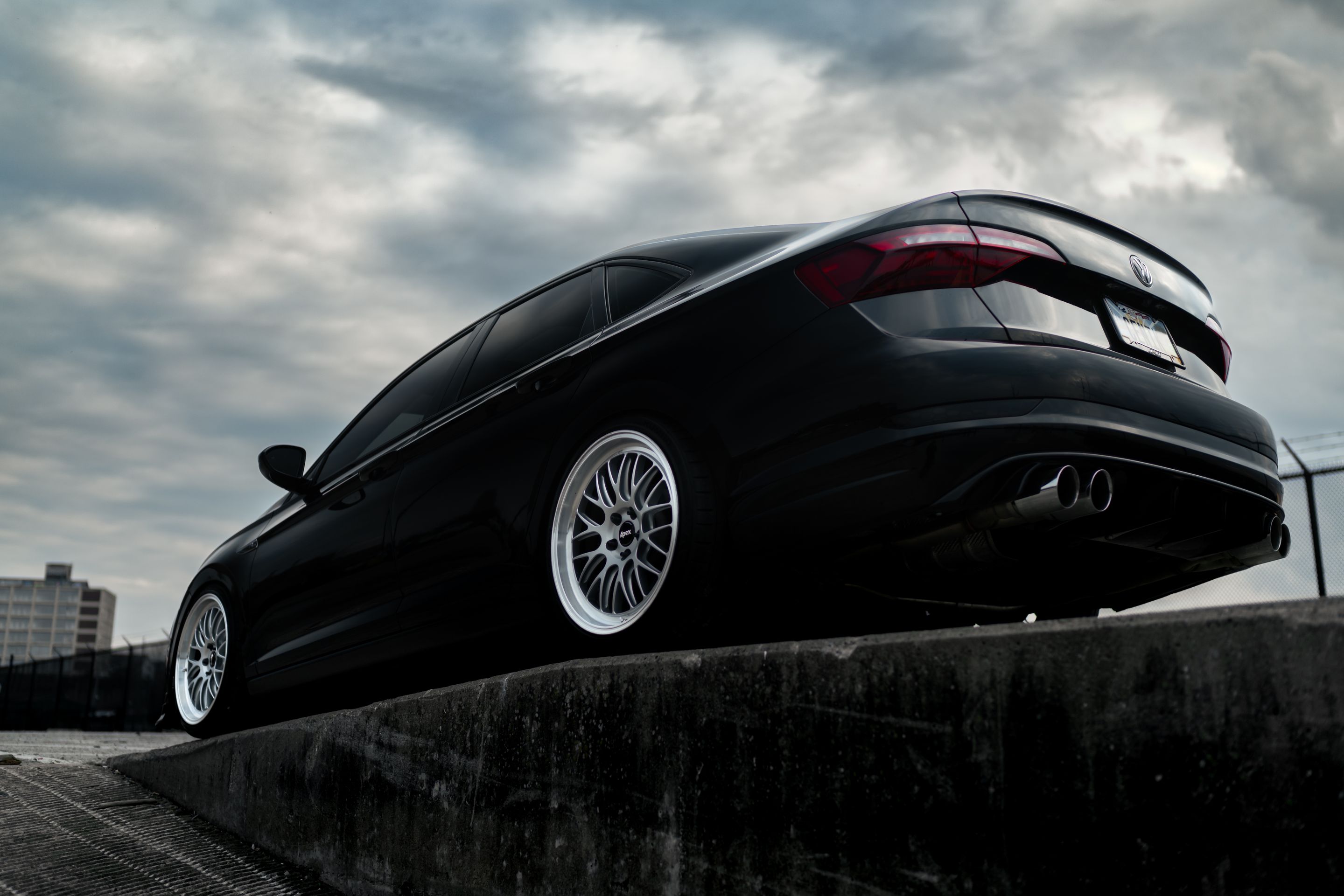 Black VW MK7 Jetta with 19" ML-10RT Apex wheels in Machined Lip Race Silver