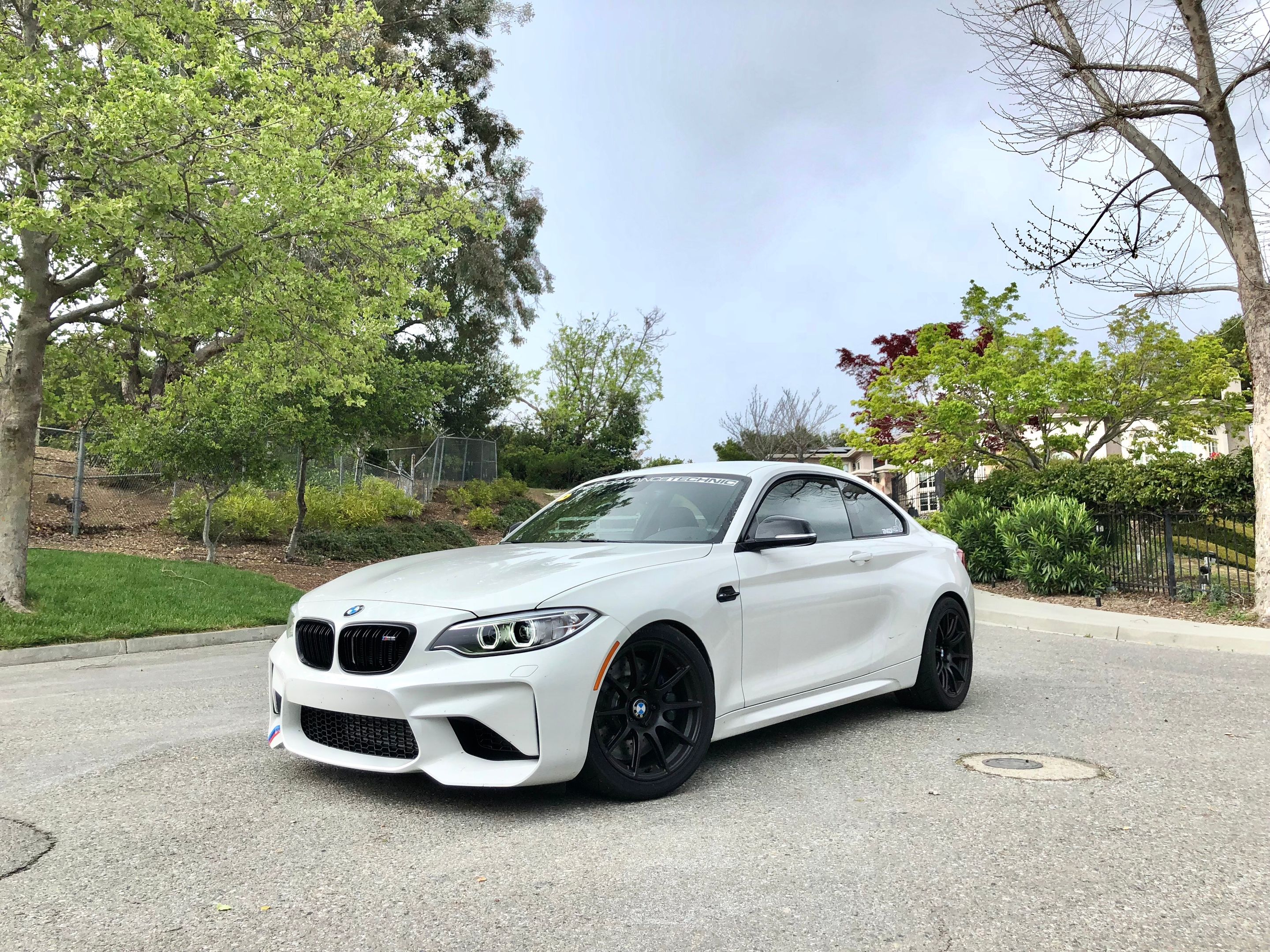 White BMW F87 M2 with 18" SM-10 Apex wheels in Satin Black