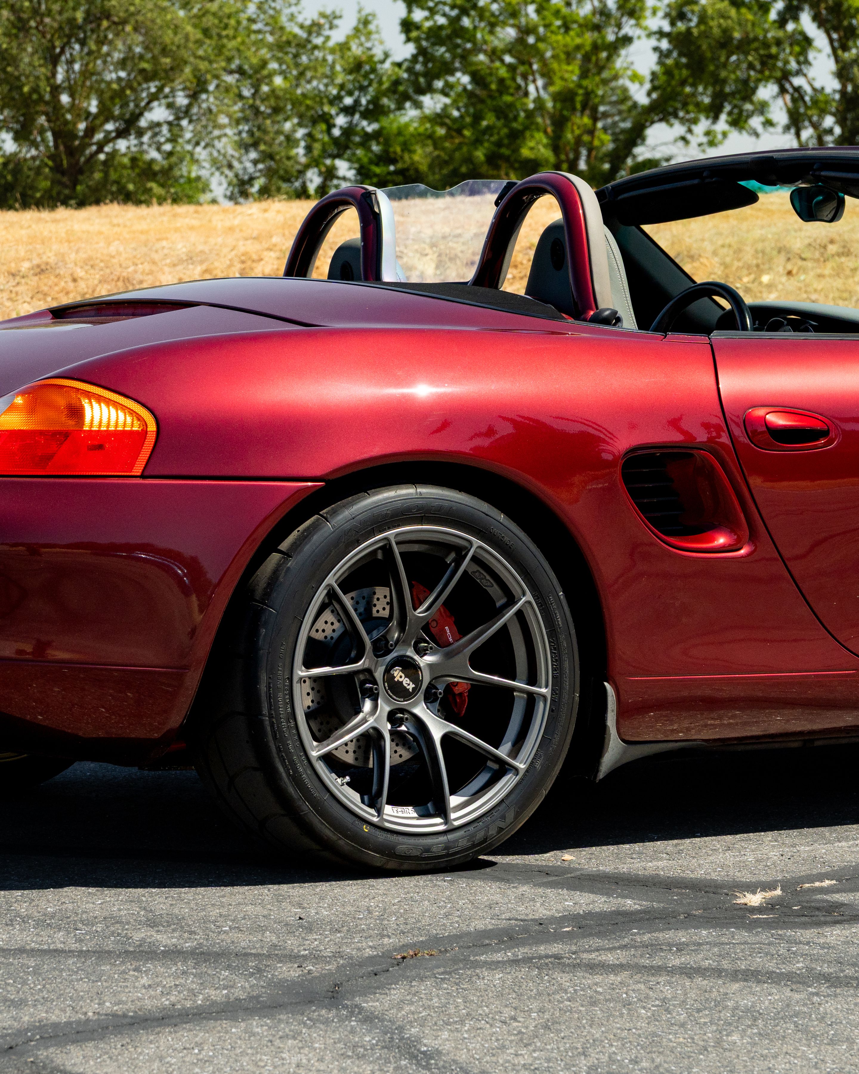 Red Porsche 986 Boxster with 18" VS-5RS Apex wheels in Anthracite