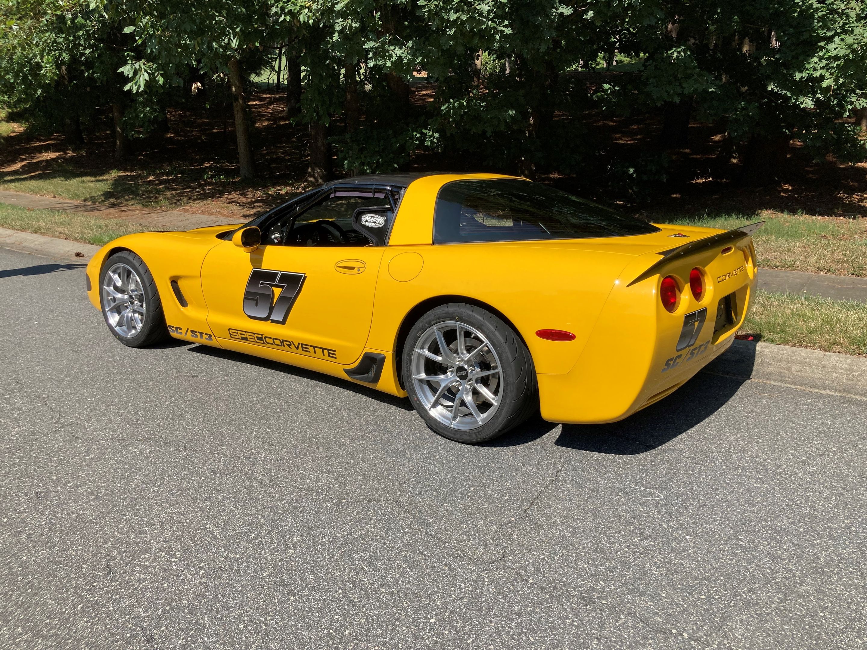 Yellow Chevrolet C5 Spec Corvette with 18" VS-5RS Apex wheels in Brushed Clear