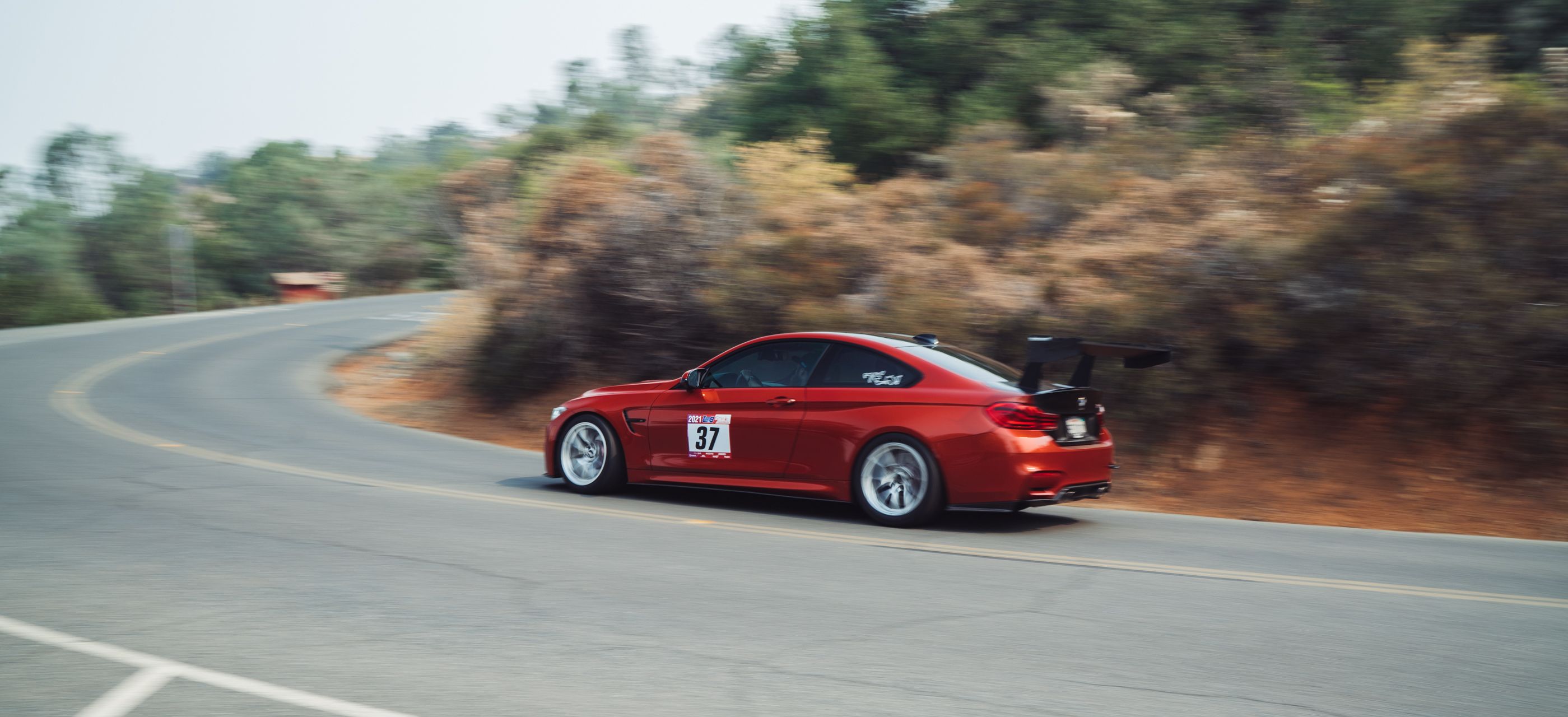Orange BMW F82 Coupe M4 with 18" VS-5RS Apex wheels in Brushed Clear