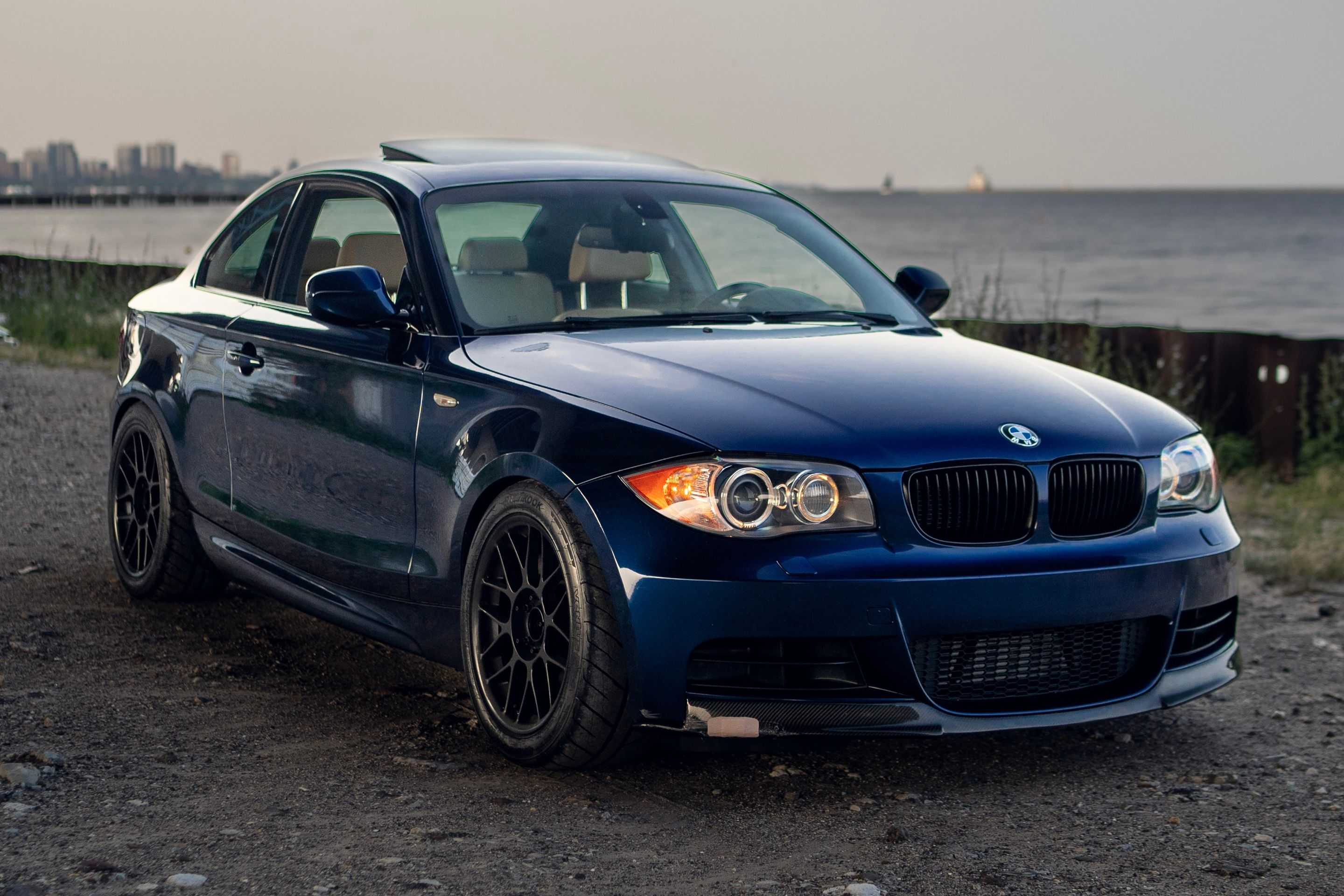 Blue BMW E82 Coupe 1 Series with 17" ARC-8 Apex wheels in Satin Black