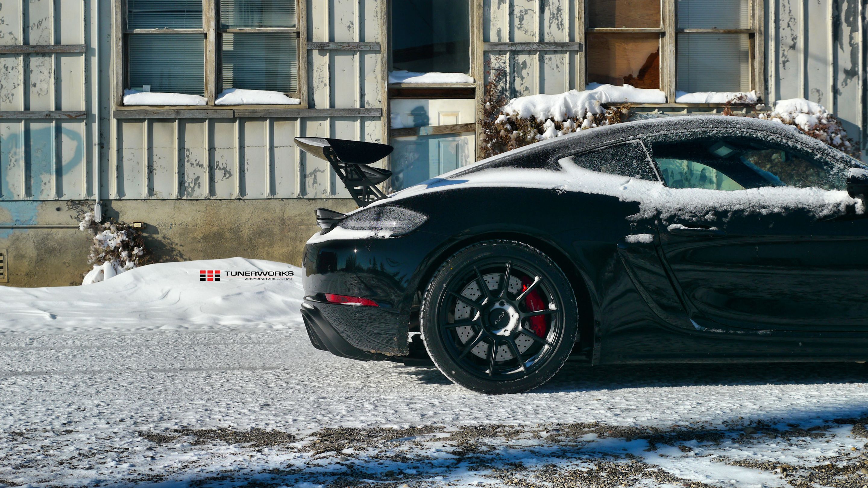 Black Porsche 718 Cayman GT4 with 19" SM-10 Apex wheels in Satin Black