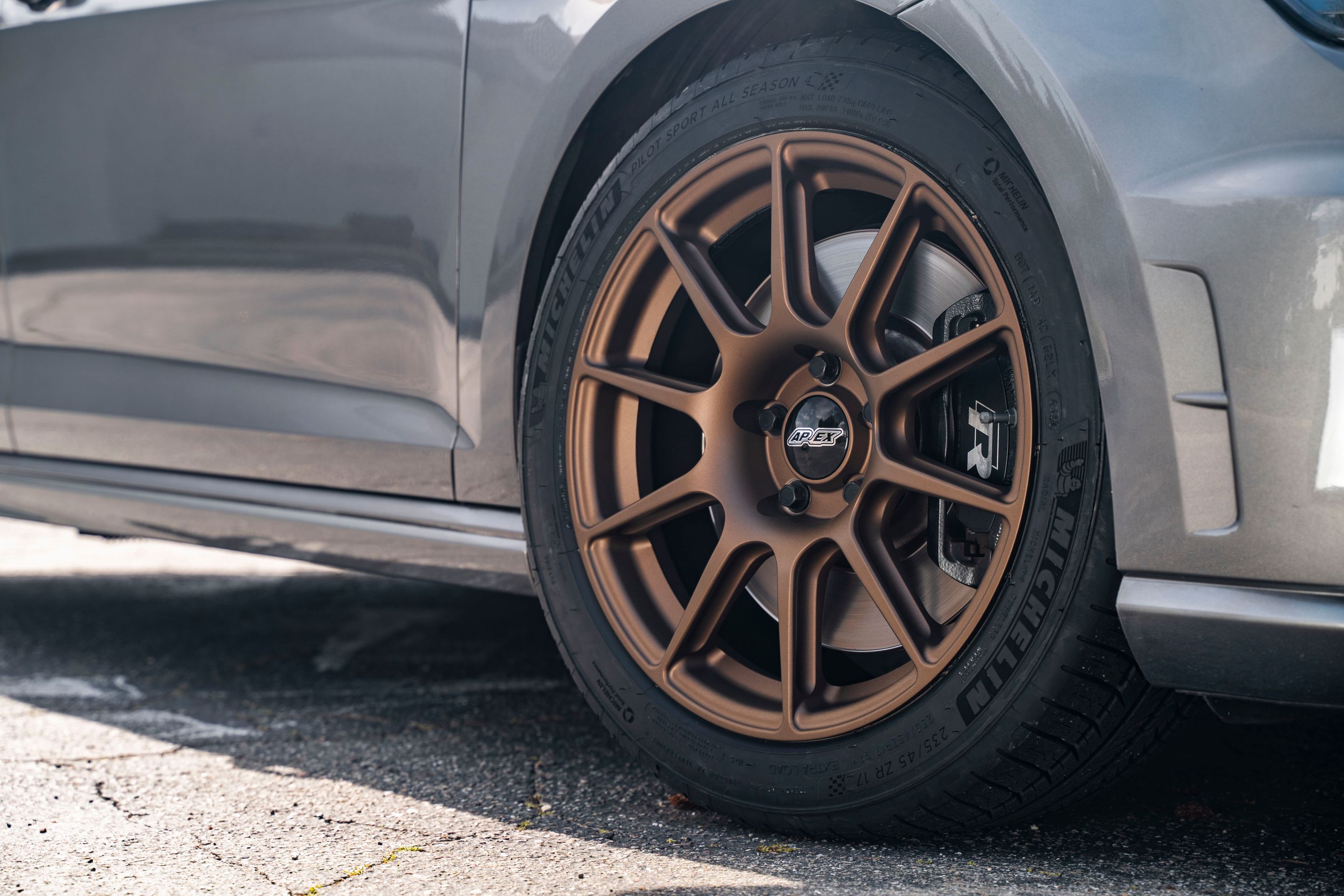 Grey VW MK7 Golf R with 17" SM-10 Apex wheels in Satin Bronze