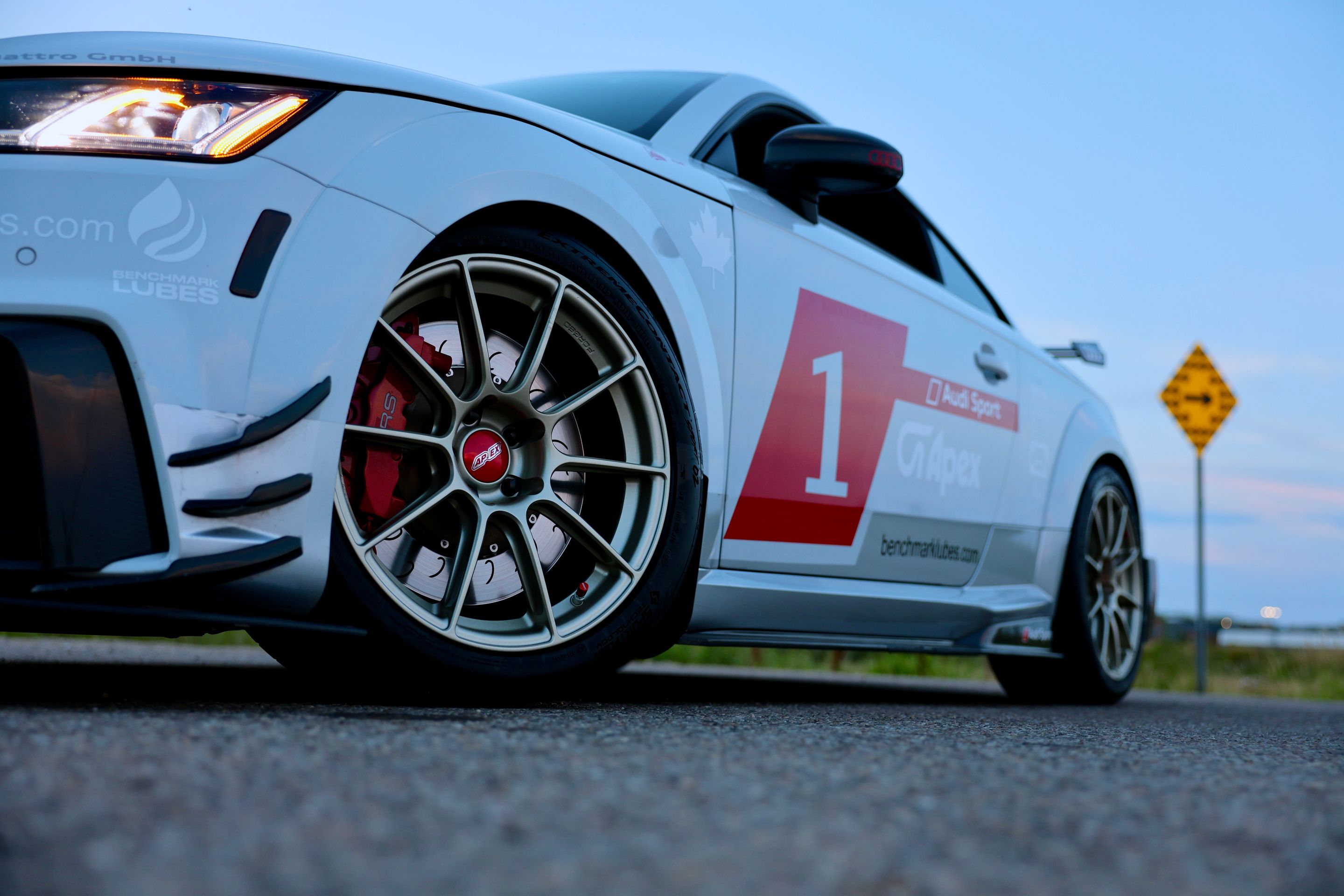 White Audi FV/8S TT RS with 18" SM-10RS Apex wheels in Motorsport Gold
