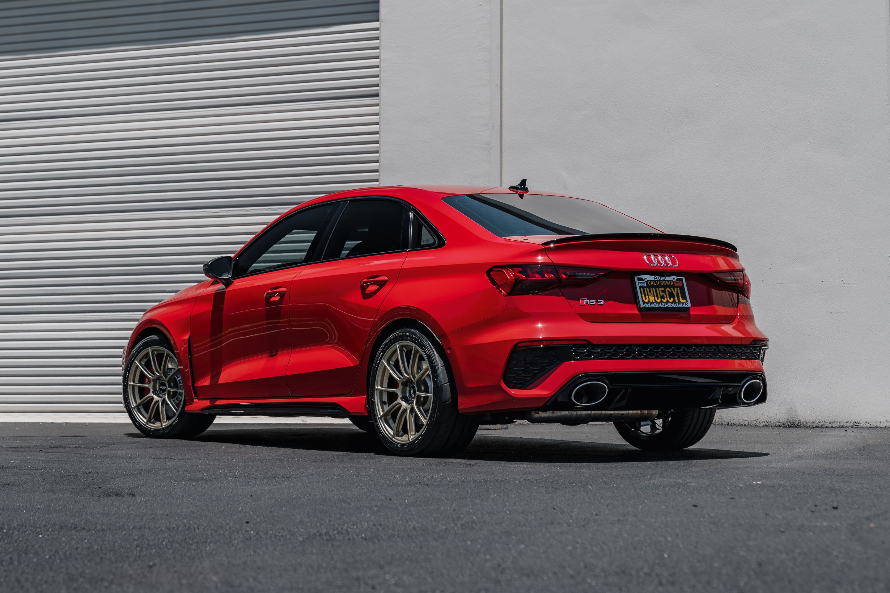 Red Audi 8Y RS 3 with 18" SM-10RS Apex wheels in Motorsport Gold