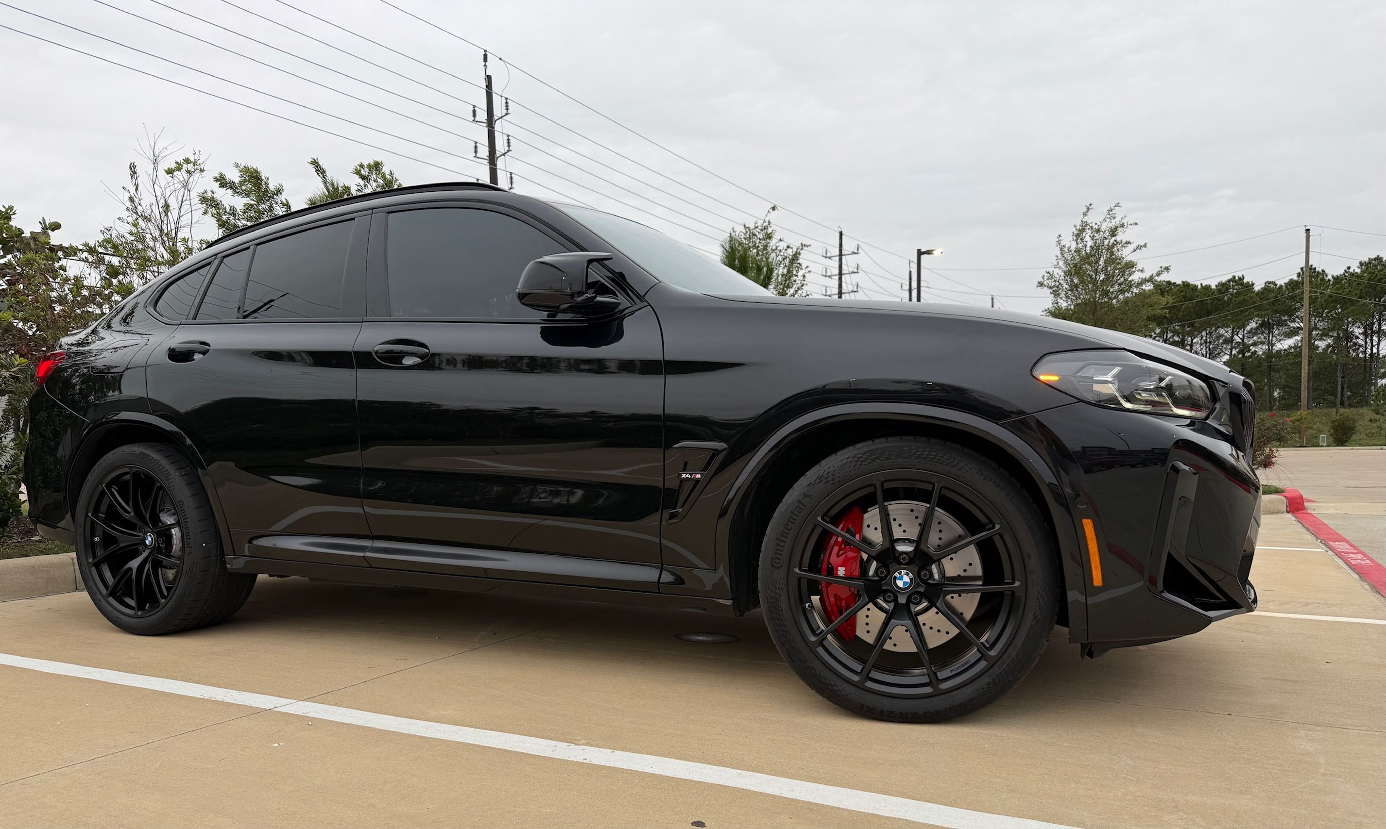 Black BMW F98 X4M with 21" VS-5RX Apex wheels in Satin Black