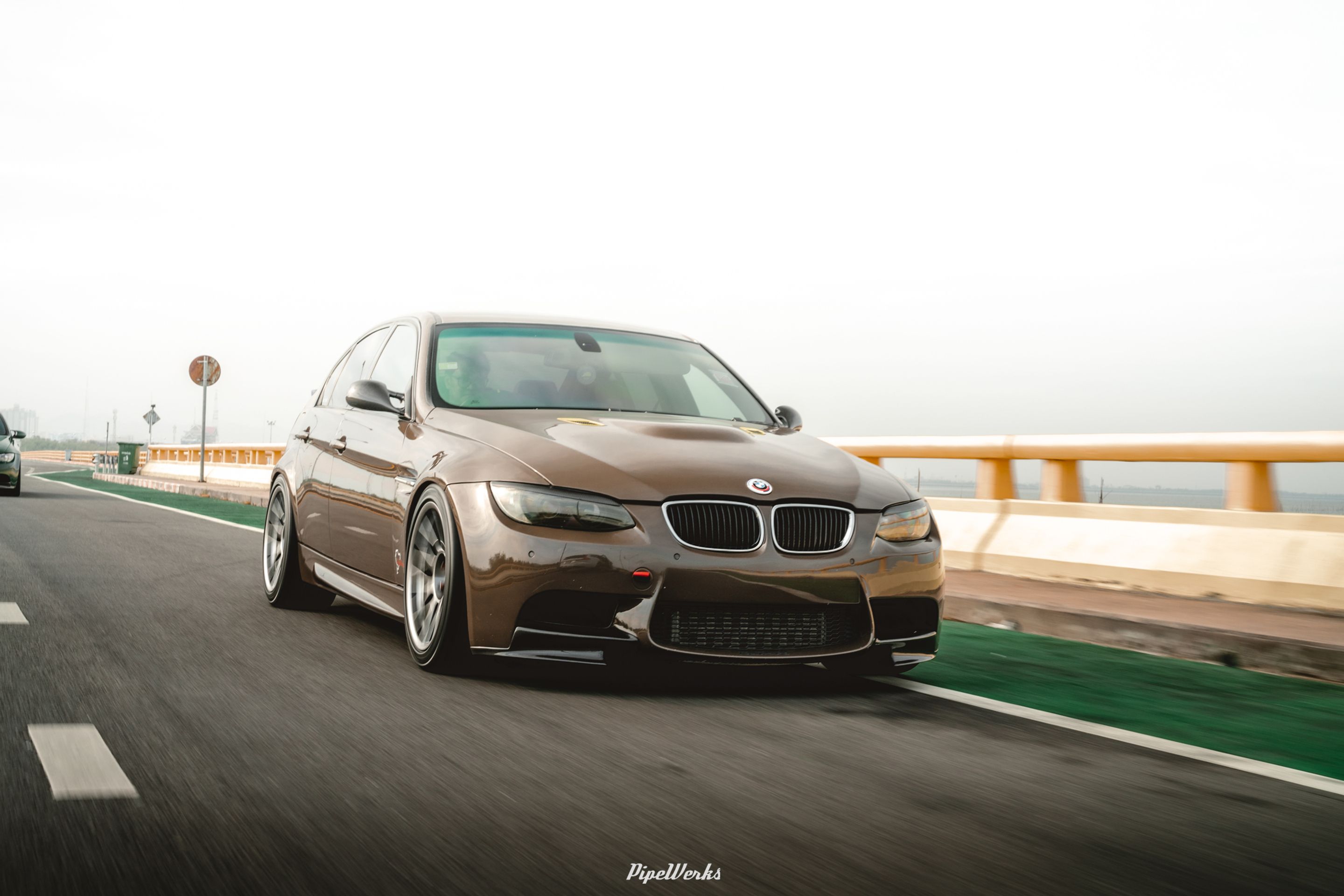Brown BMW E90 Sedan 3 Series with 18" ARC-8 Apex wheels in Hyper Black