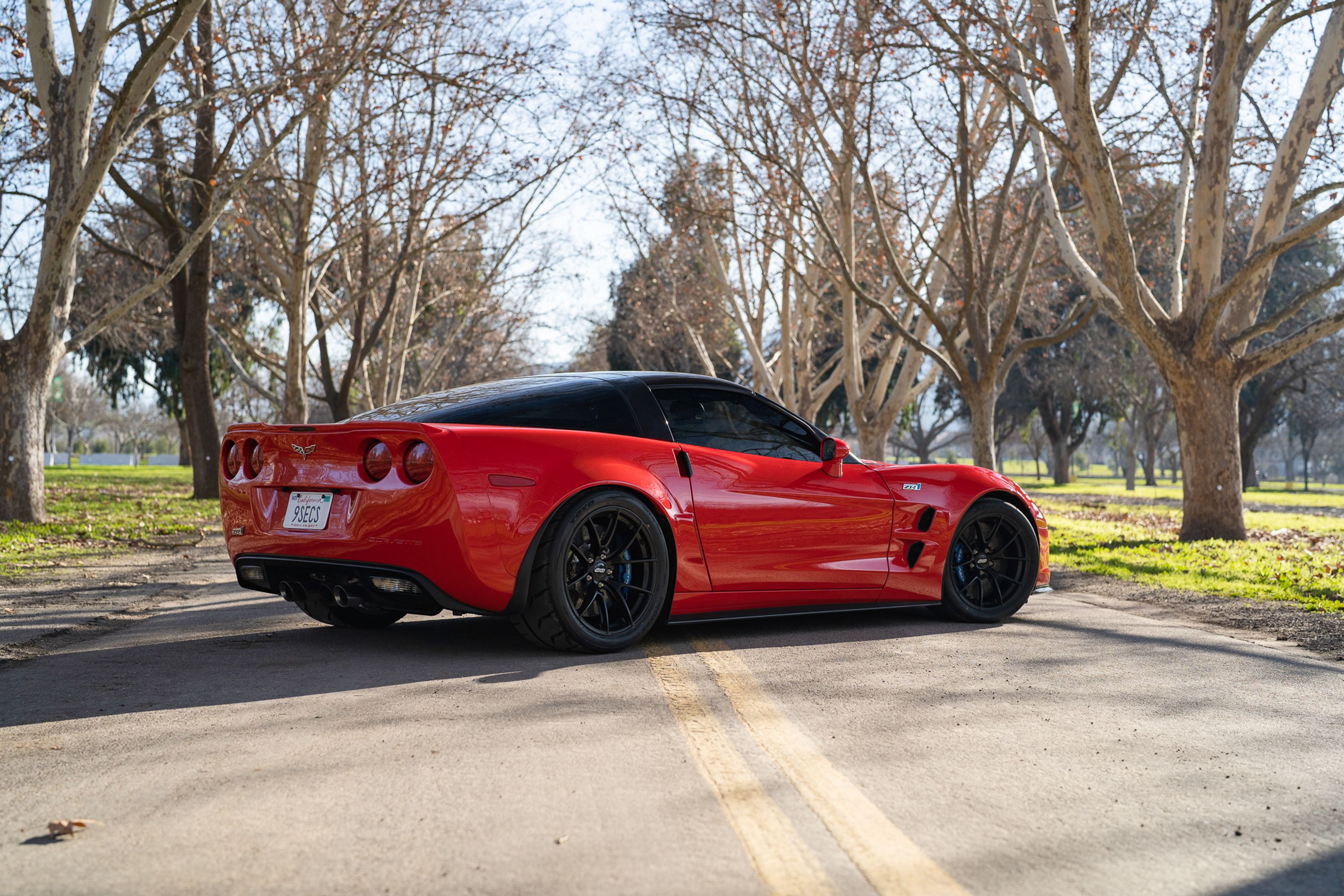 Red Chevrolet C6 Corvette ZR-1 with 19" VS-5RS Apex wheels in Satin Black