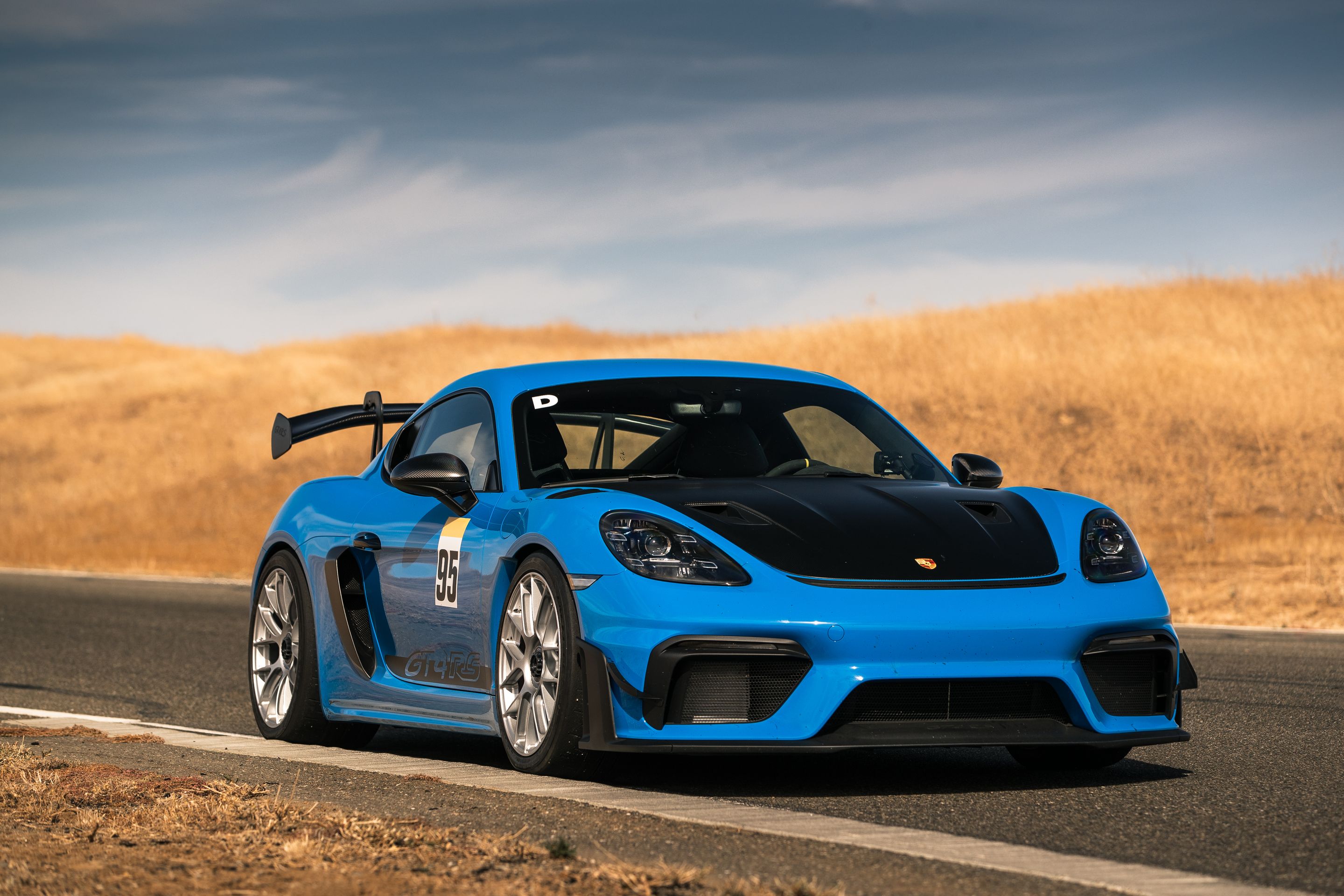 Blue Porsche 718 Cayman GT4 RS with 19" EC-7RS Apex wheels in Race Silver