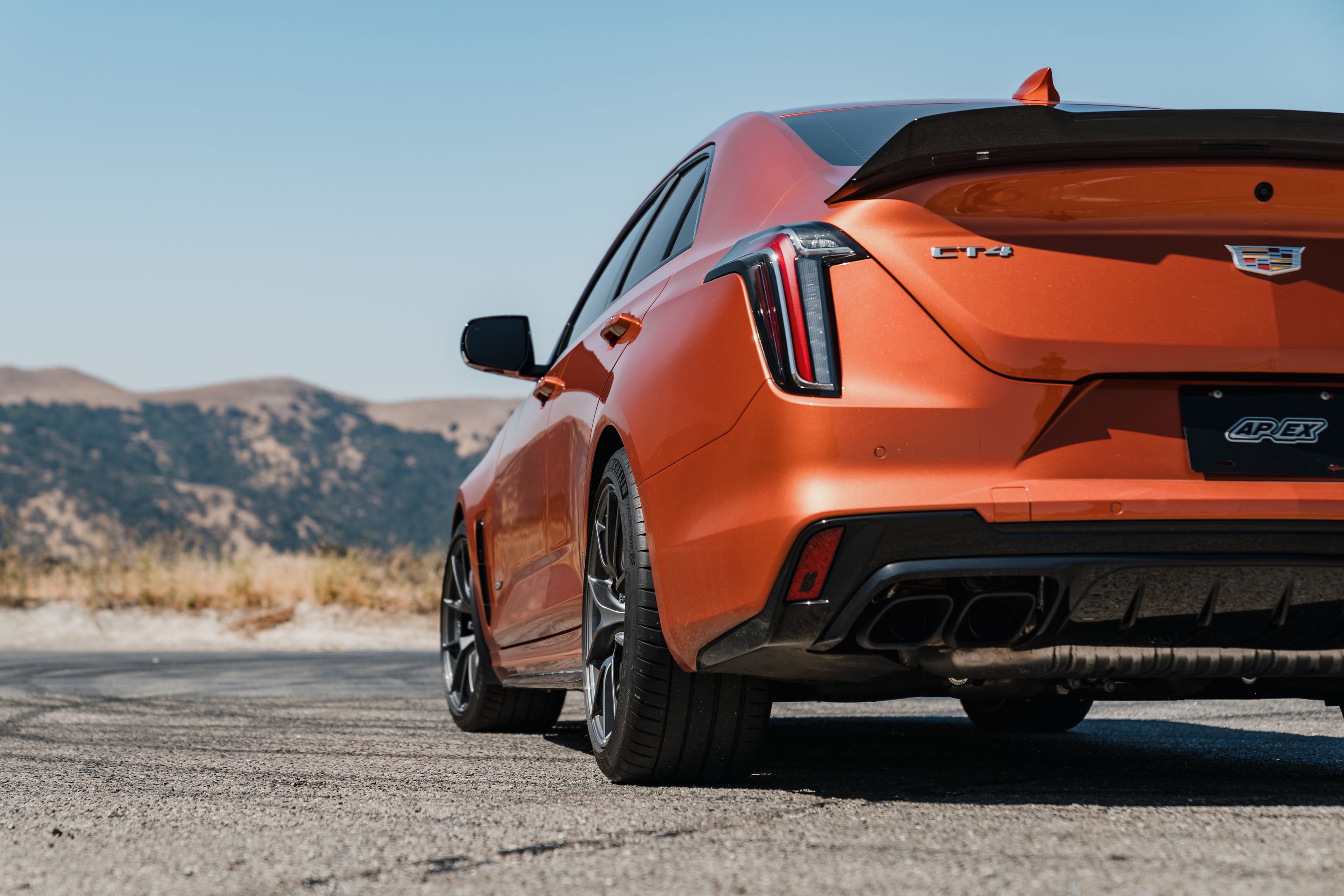 Orange Cadillac CT4-V Blackwing with 18" VS-5RS Apex wheels in Anthracite