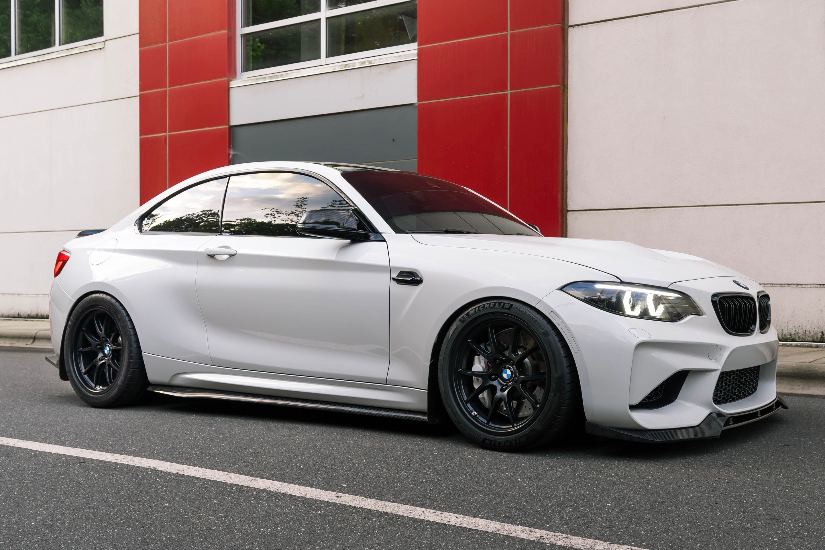 White BMW F87 M2 with 18" FL-5 Apex wheels in Satin Black