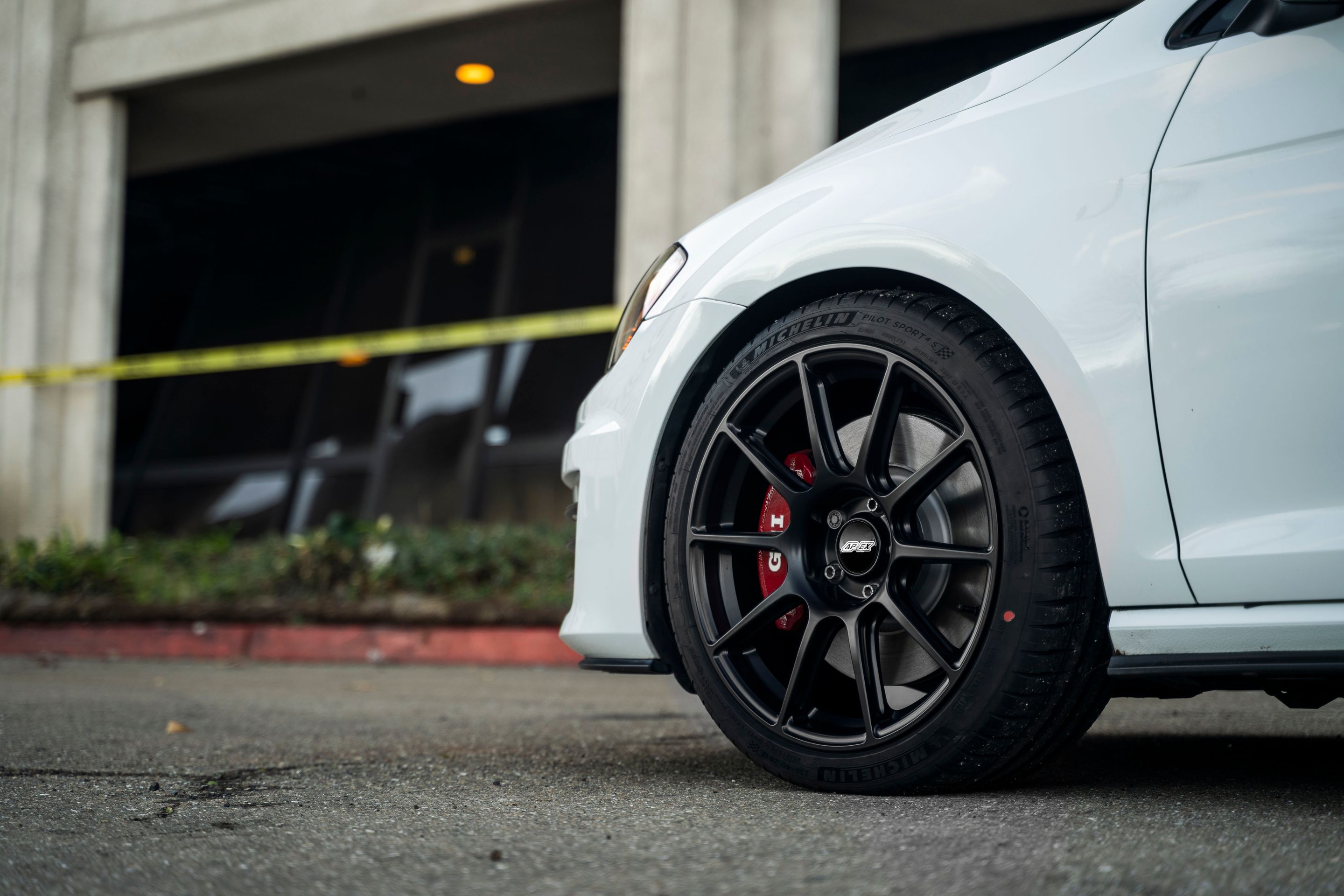 White VW MK7 GTI with 18" SM-10 Apex wheels in Satin Black