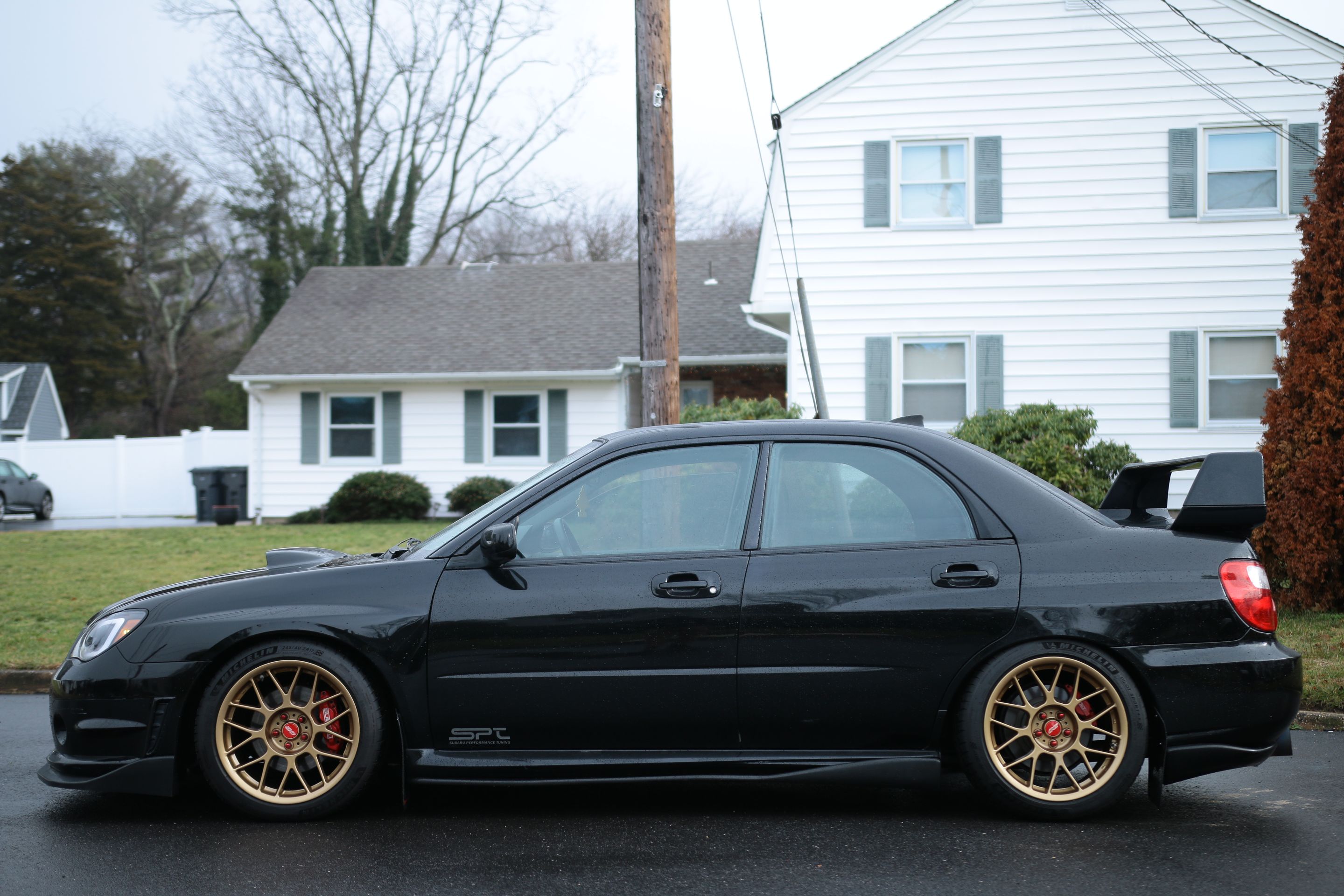 Black Subaru GD WRX Sedan with 17" ARC-8 Apex wheels in Satin Bronze