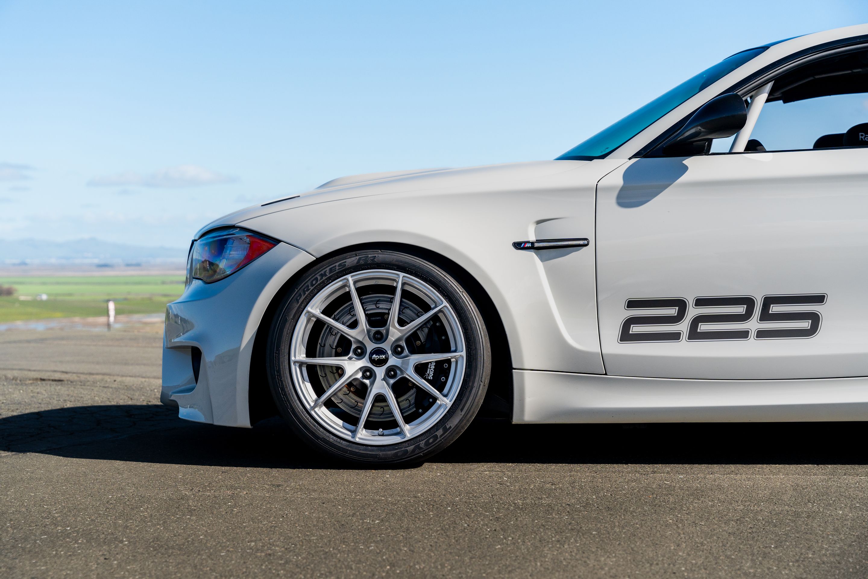 White BMW E82 1M with 18" VS-5 Apex wheels in Race Silver
