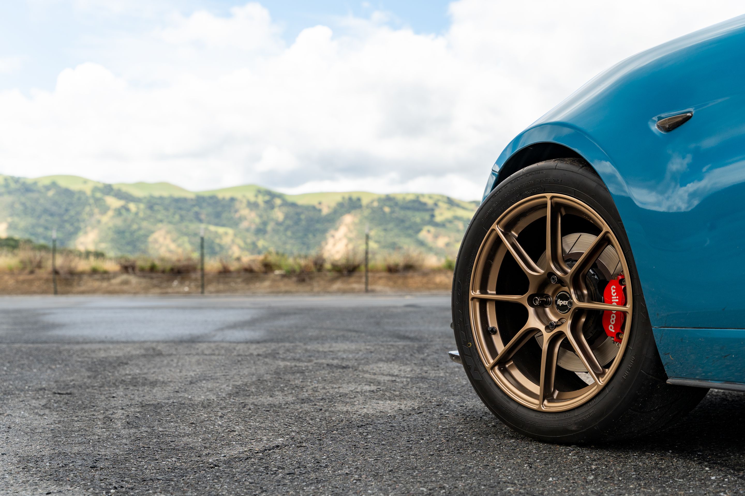 Blue Mazda ND MX-5 Miata with 17" SM-8RS Apex wheels in Satin Bronze