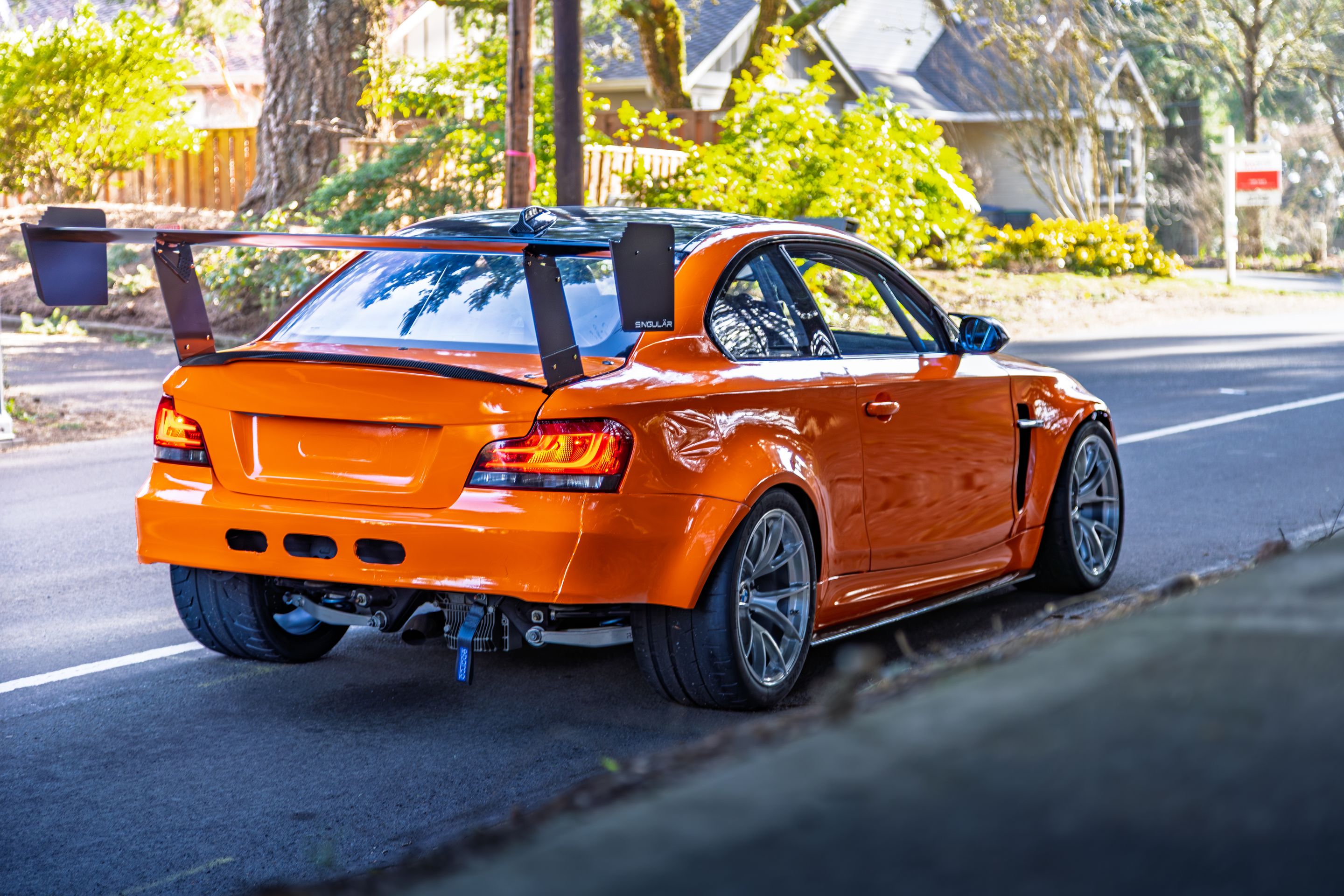 Orange BMW E82 1M with 18" VS-5RS Apex wheels in Brushed Clear