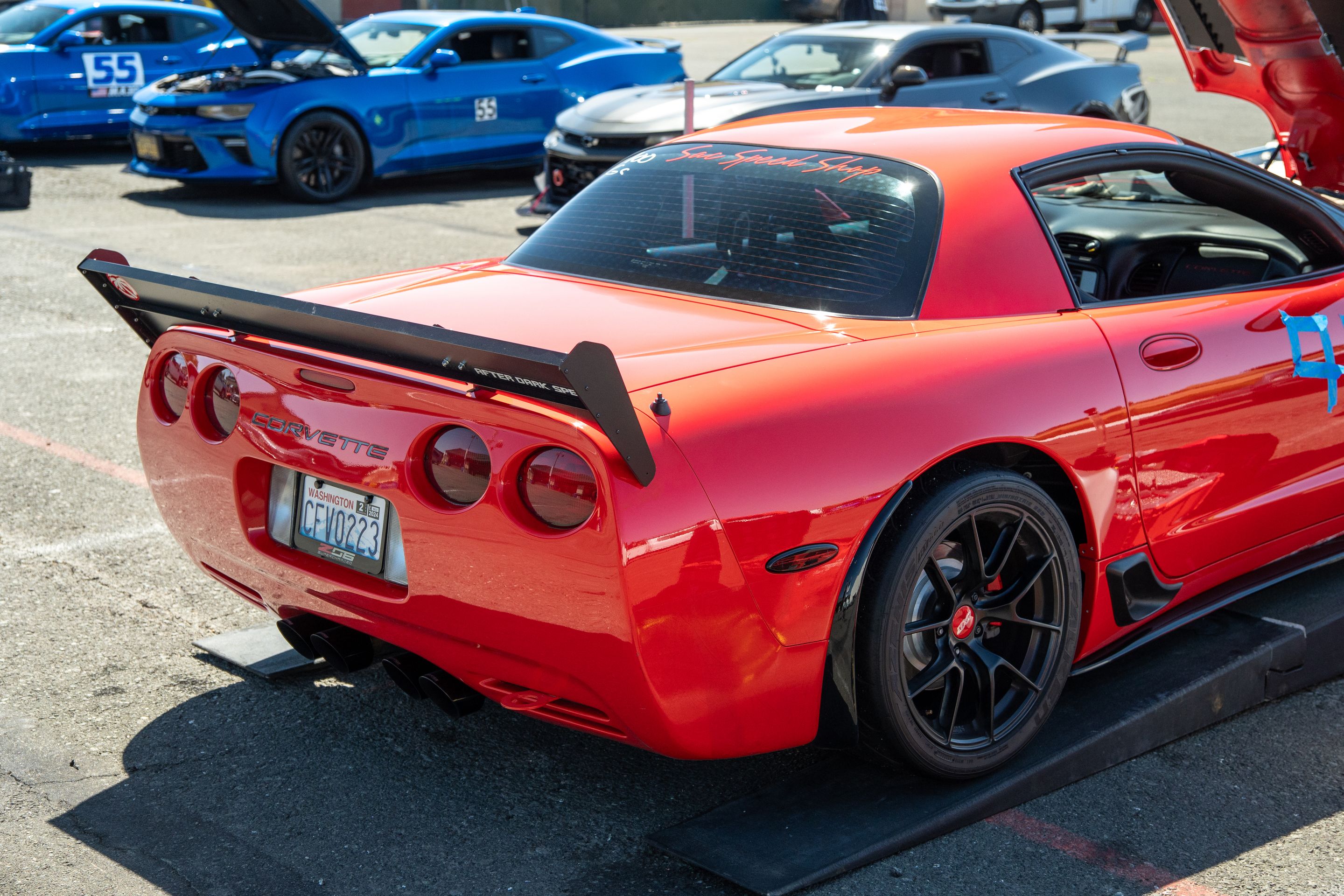 Red Chevrolet C5 Corvette Z06 with 18" VS-5RS Apex wheels in Satin Black