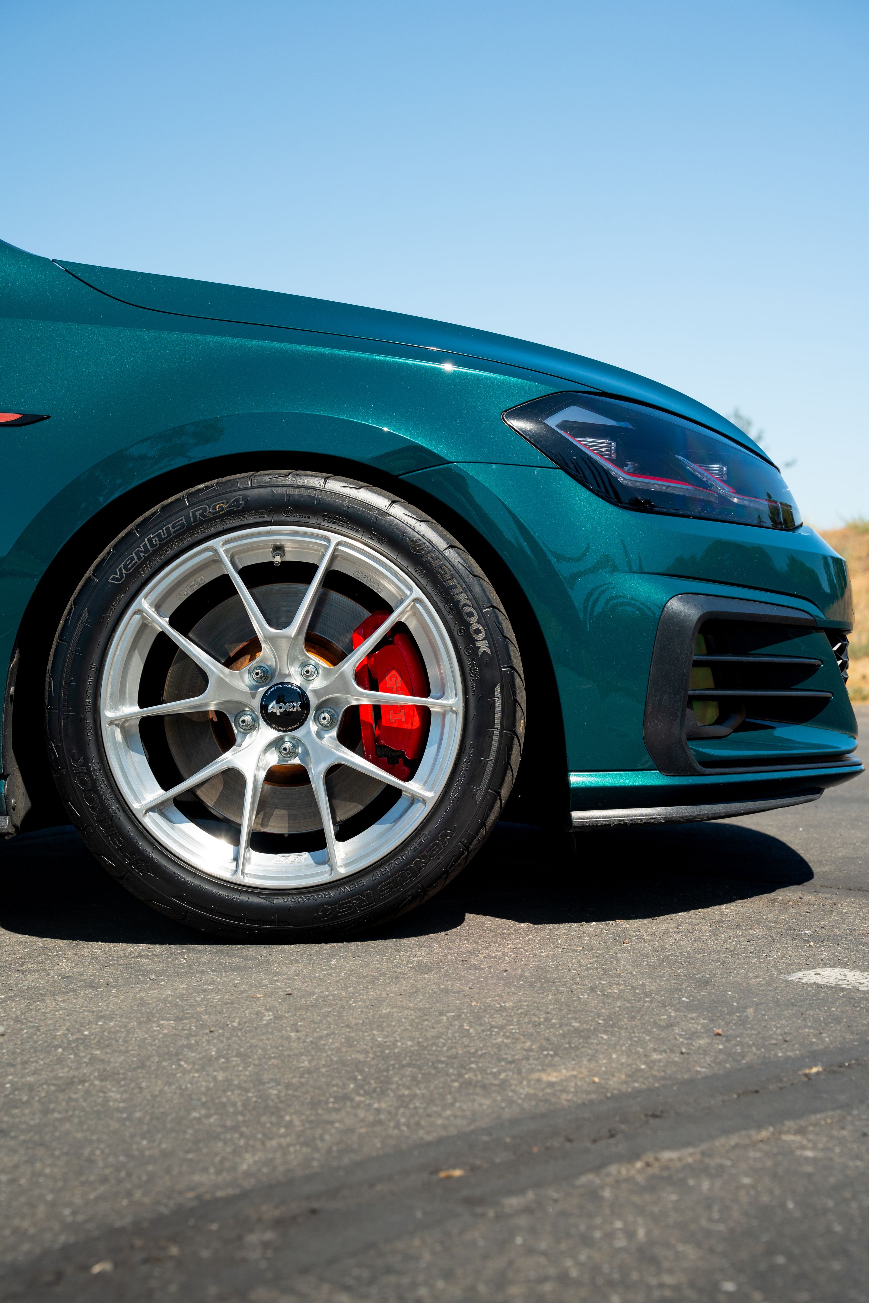 Green VW MK7 GTI with 17" VS-5RS Apex wheels in Brushed Clear