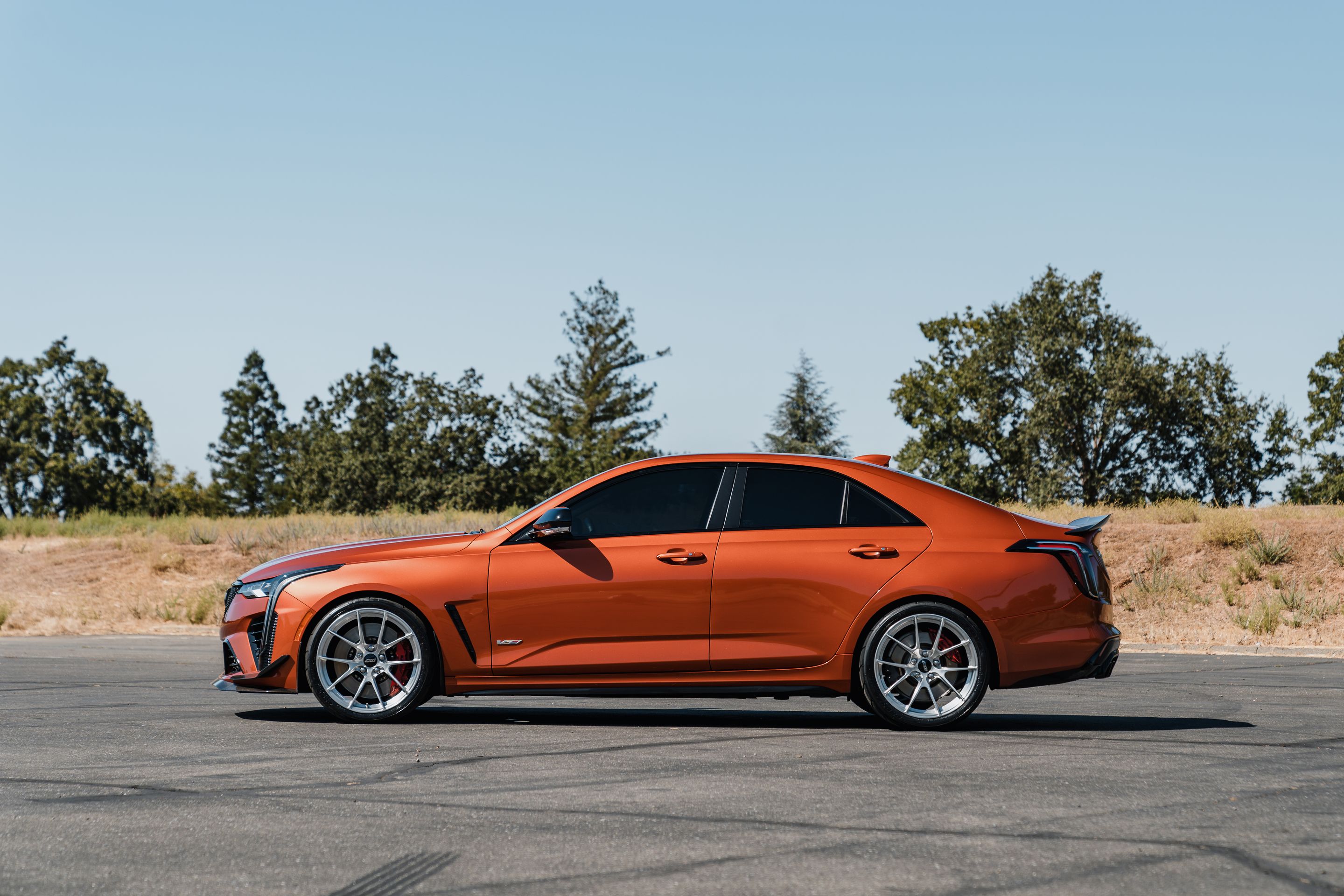 Orange Cadillac CT4-V Blackwing with 19" VS-5RS Apex wheels in Brushed Clear