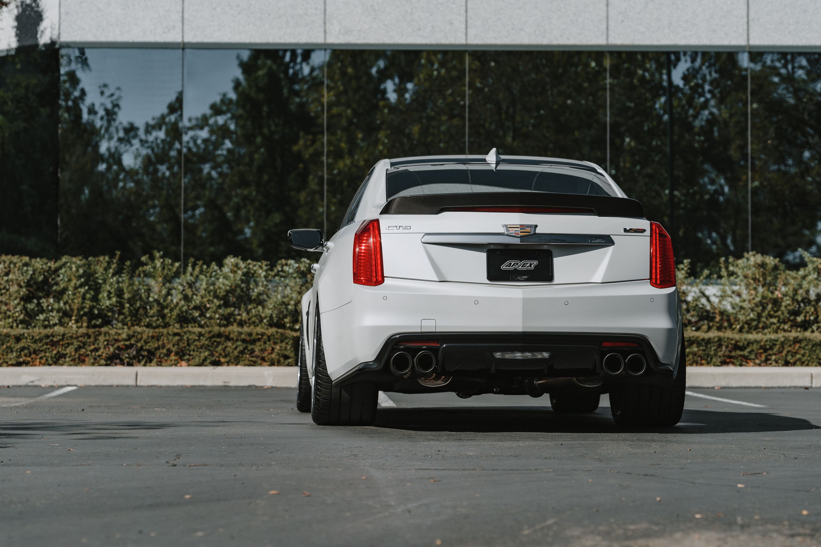 White Cadillac Gen 3 CTS-V with 20" VS-5RS Apex wheels in Brushed Clear