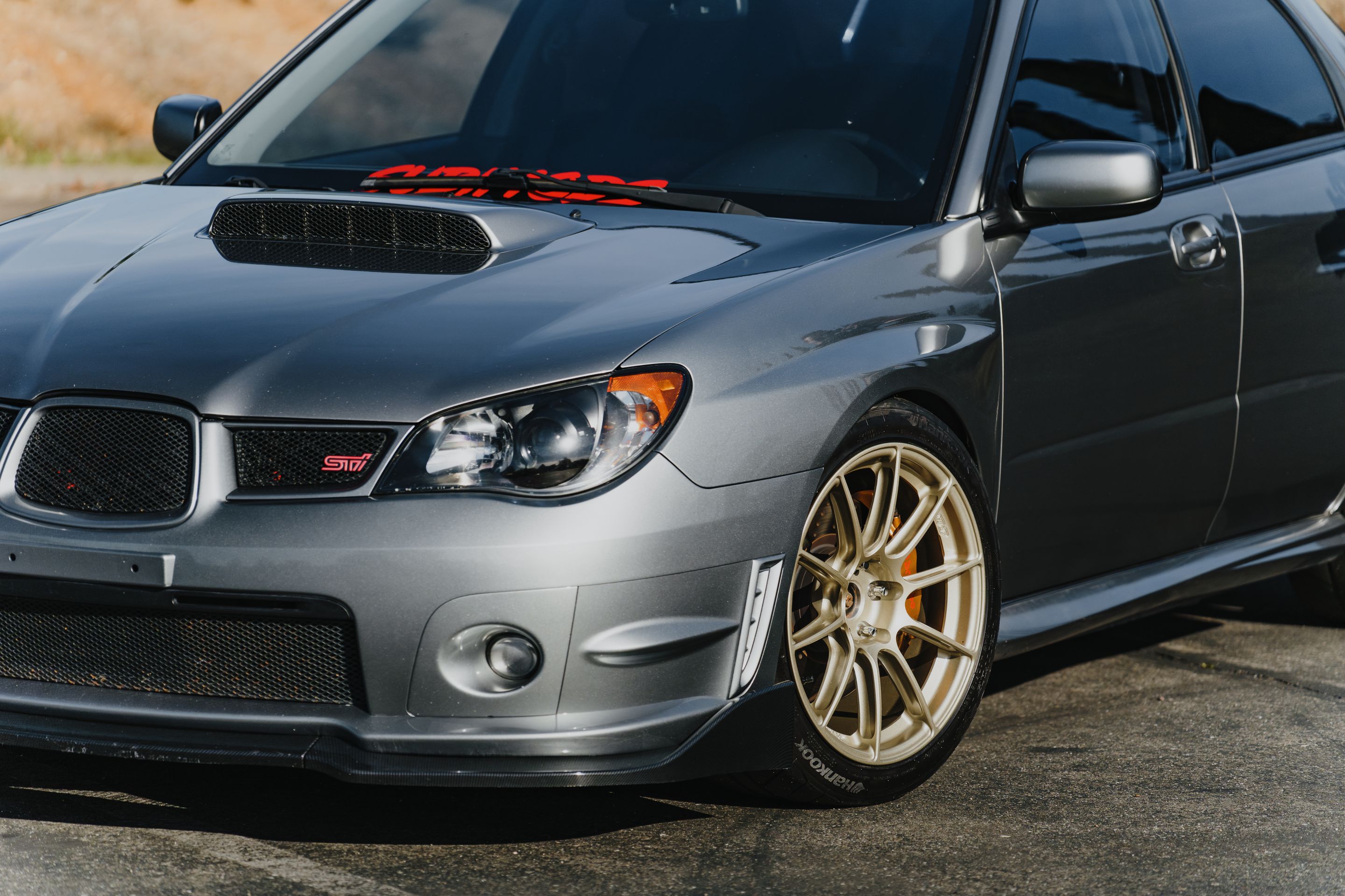 Silver Subaru GD WRX STI with 18" SM-10RS Apex wheels in Motorsport Gold