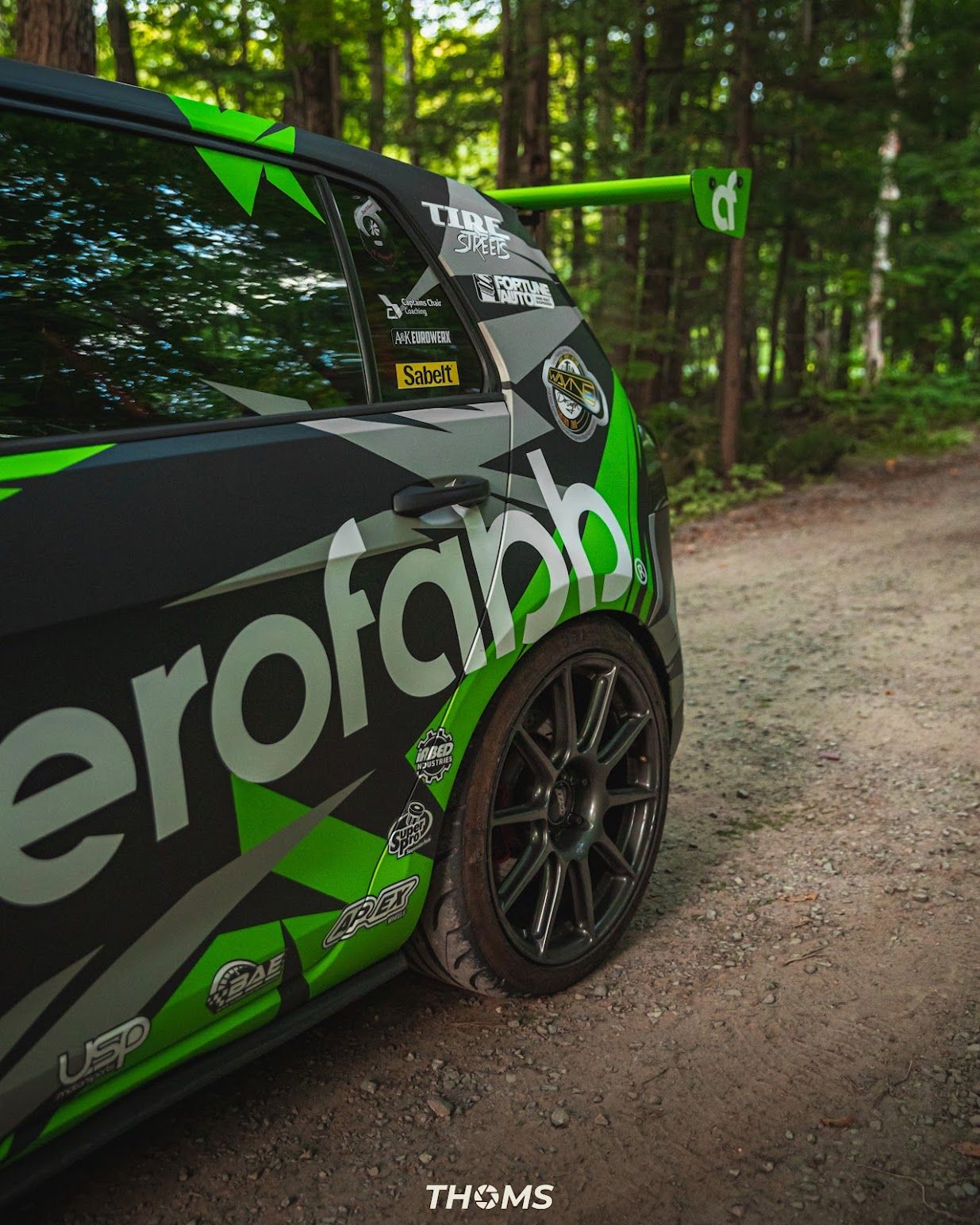 Race Livery VW MK7 GTI with 18" SM-10 Apex wheels in Satin Black