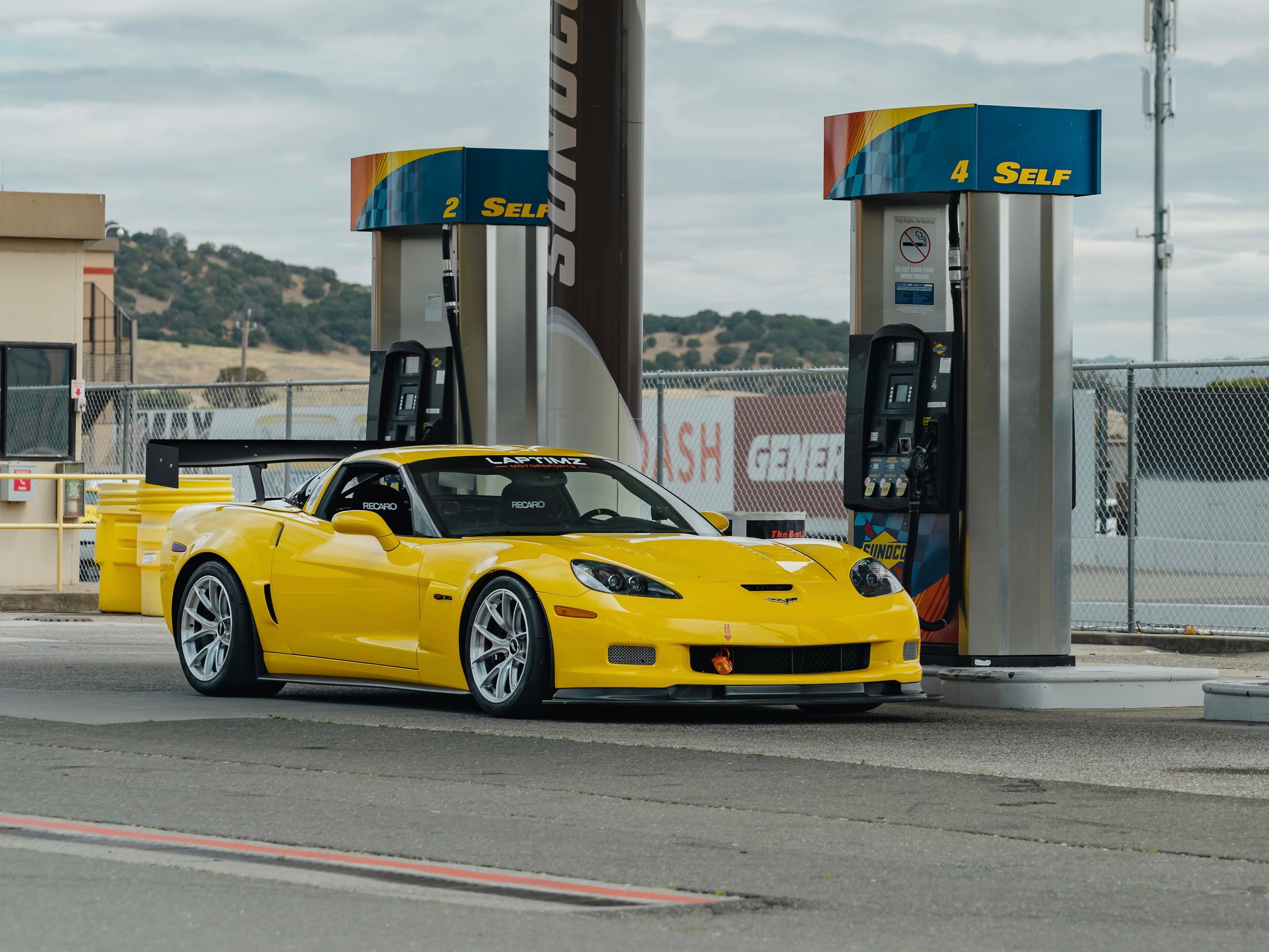 Yellow Chevrolet C6 Corvette Z06 with 18" VS-5RS Apex wheels in Brushed Clear