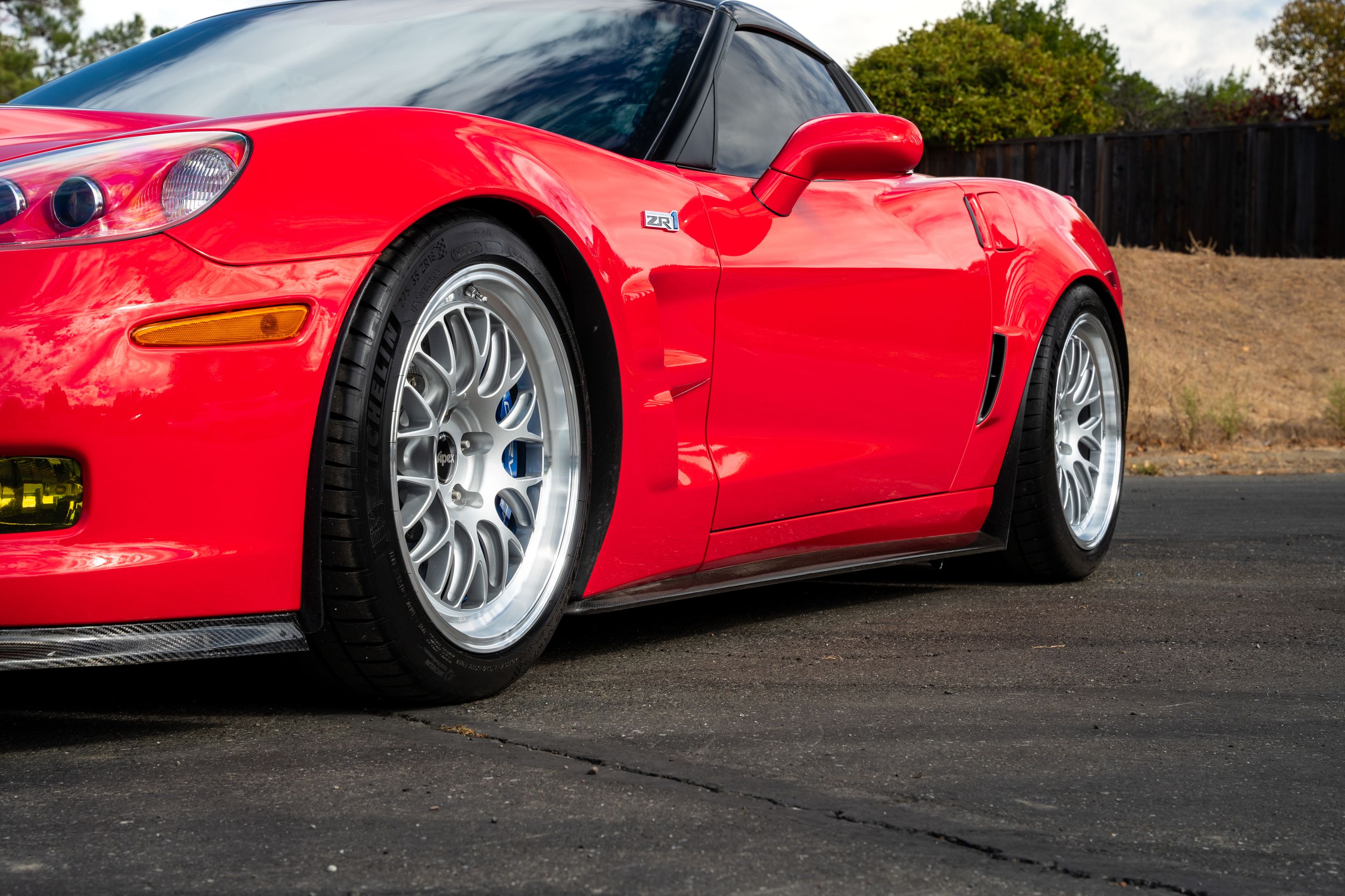 Red Chevrolet C6 Corvette ZR-1 with 18"/19" ML-10RT Apex wheels in Machined Lip Race Silver
