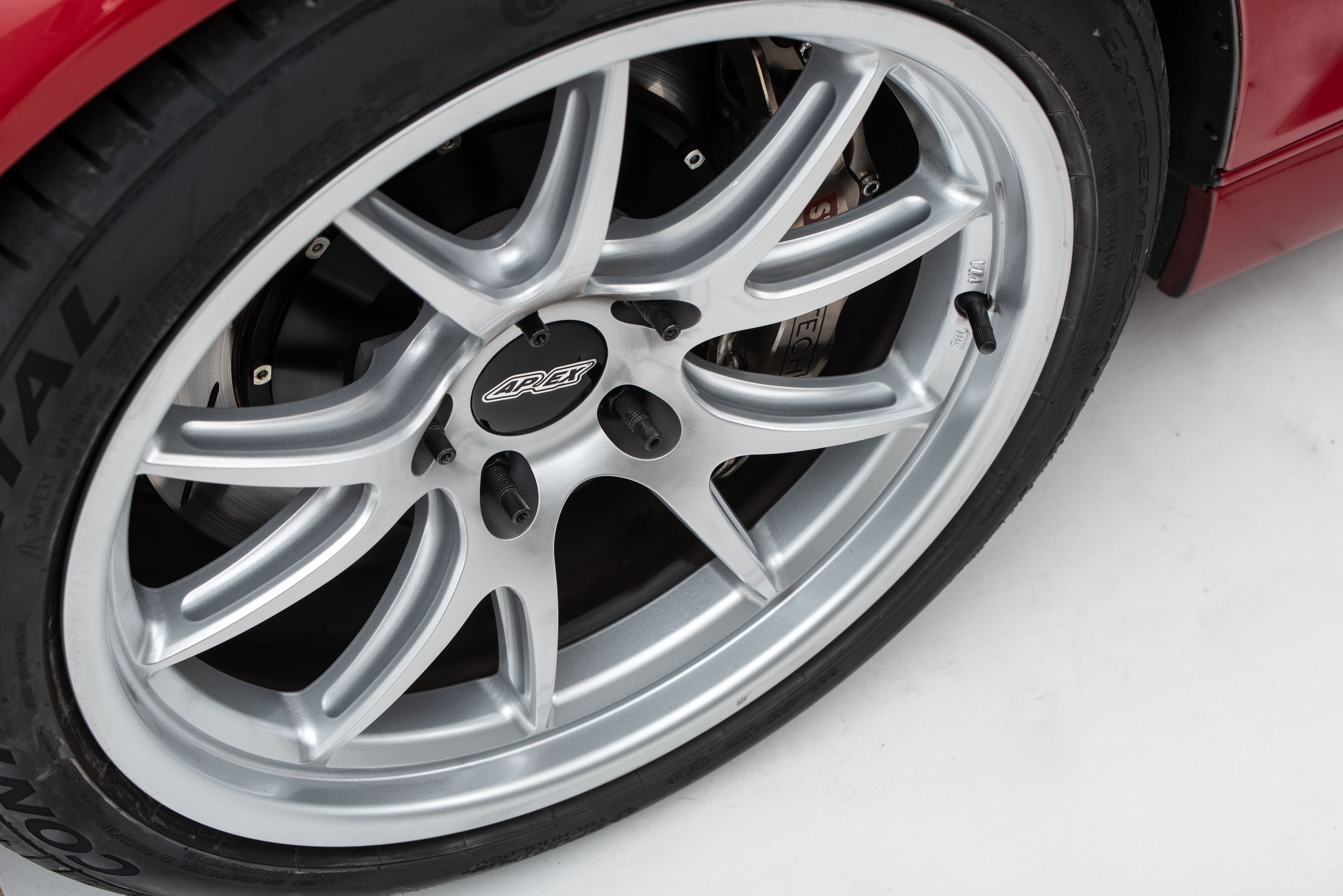 Red BMW E46 M3 with 18" FL-5 Apex wheels in Race Silver