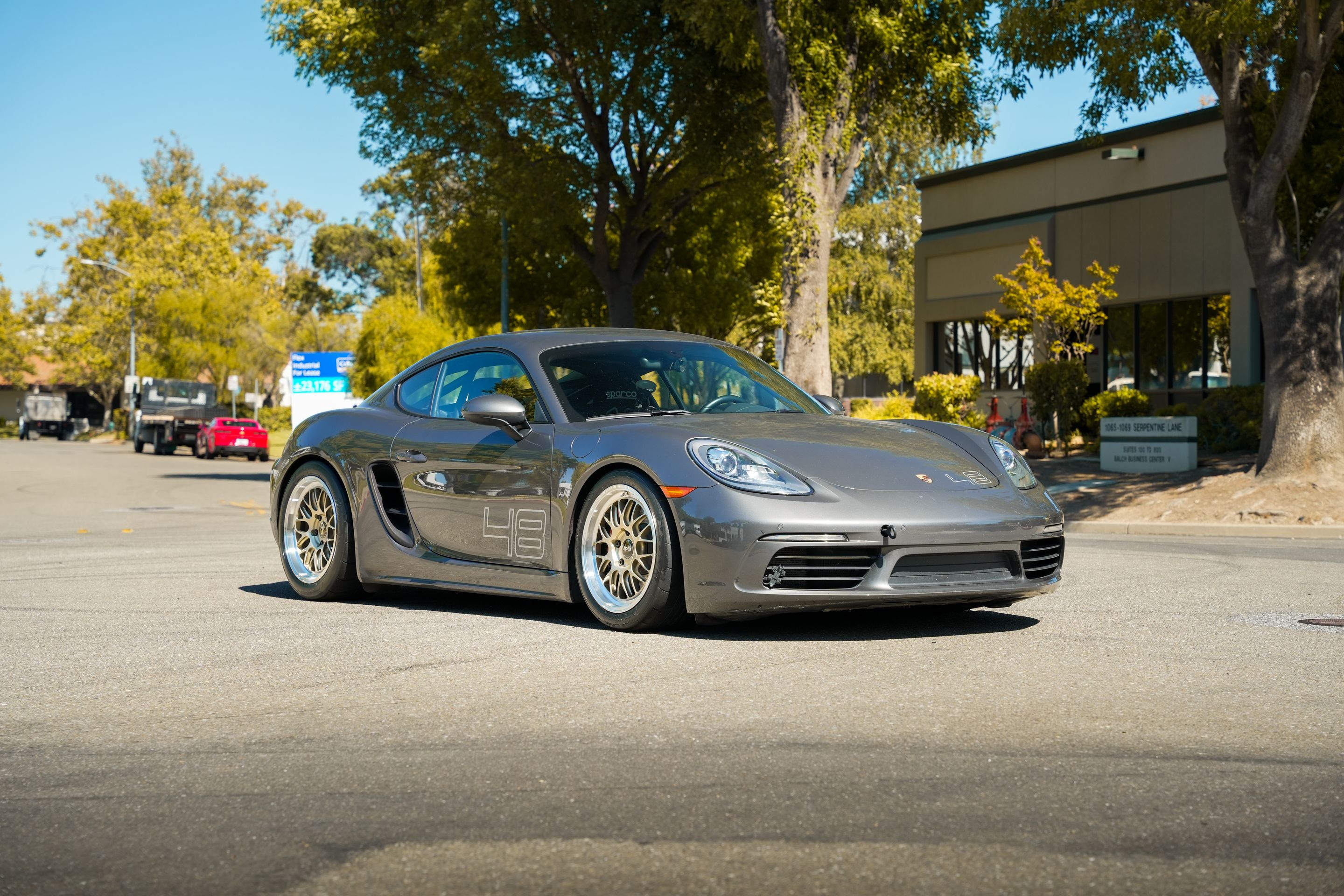 Grey Porsche 718 Cayman S with 18" ML-10RT Apex wheels in Machined Lip Gloss Motorsport Gold