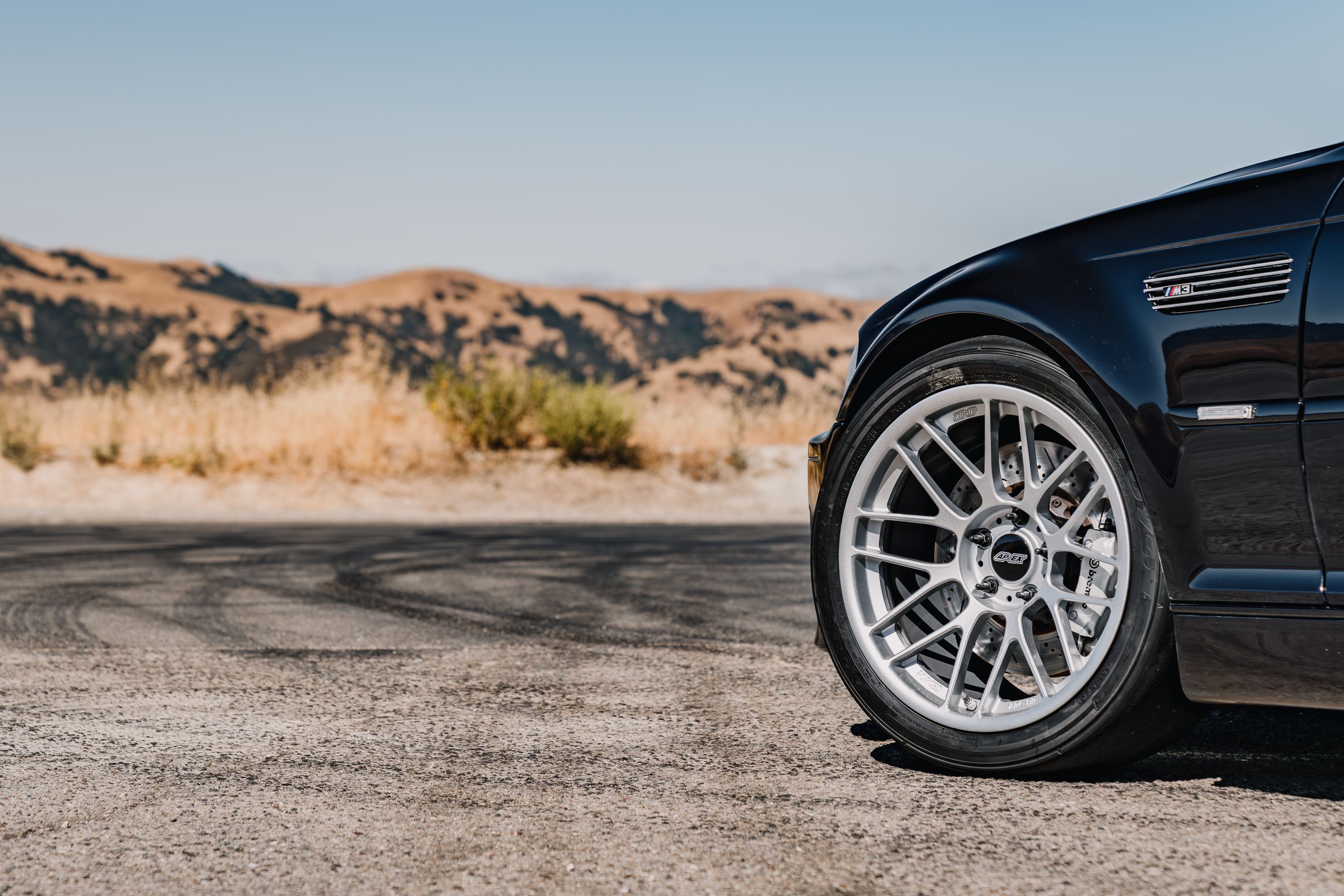 Black BMW E46 M3 with 18" ARC-8RT Apex wheels in Race Silver