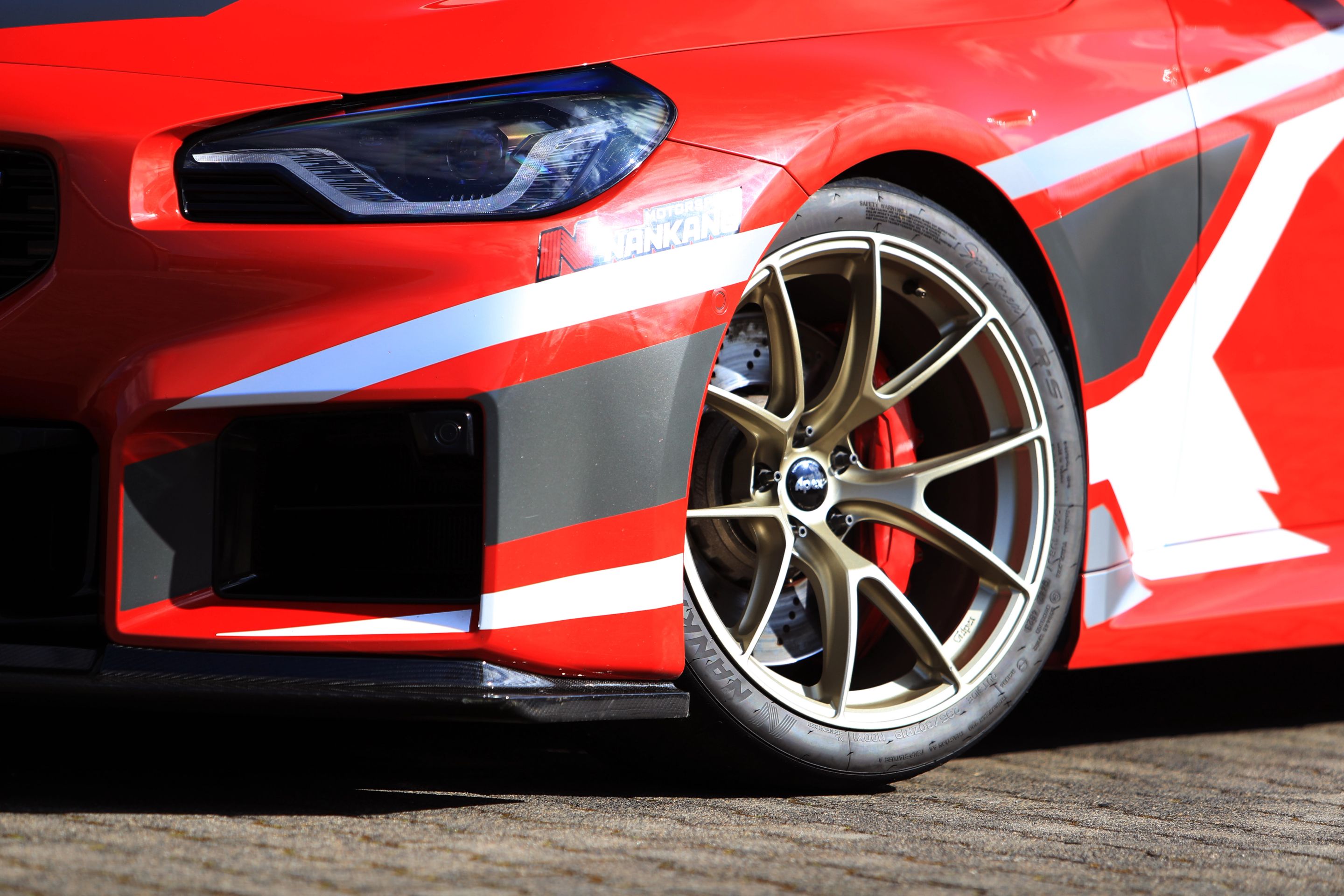 Red BMW G87 M2 with 19" VS-5RS Apex wheels in Motorsport Gold
