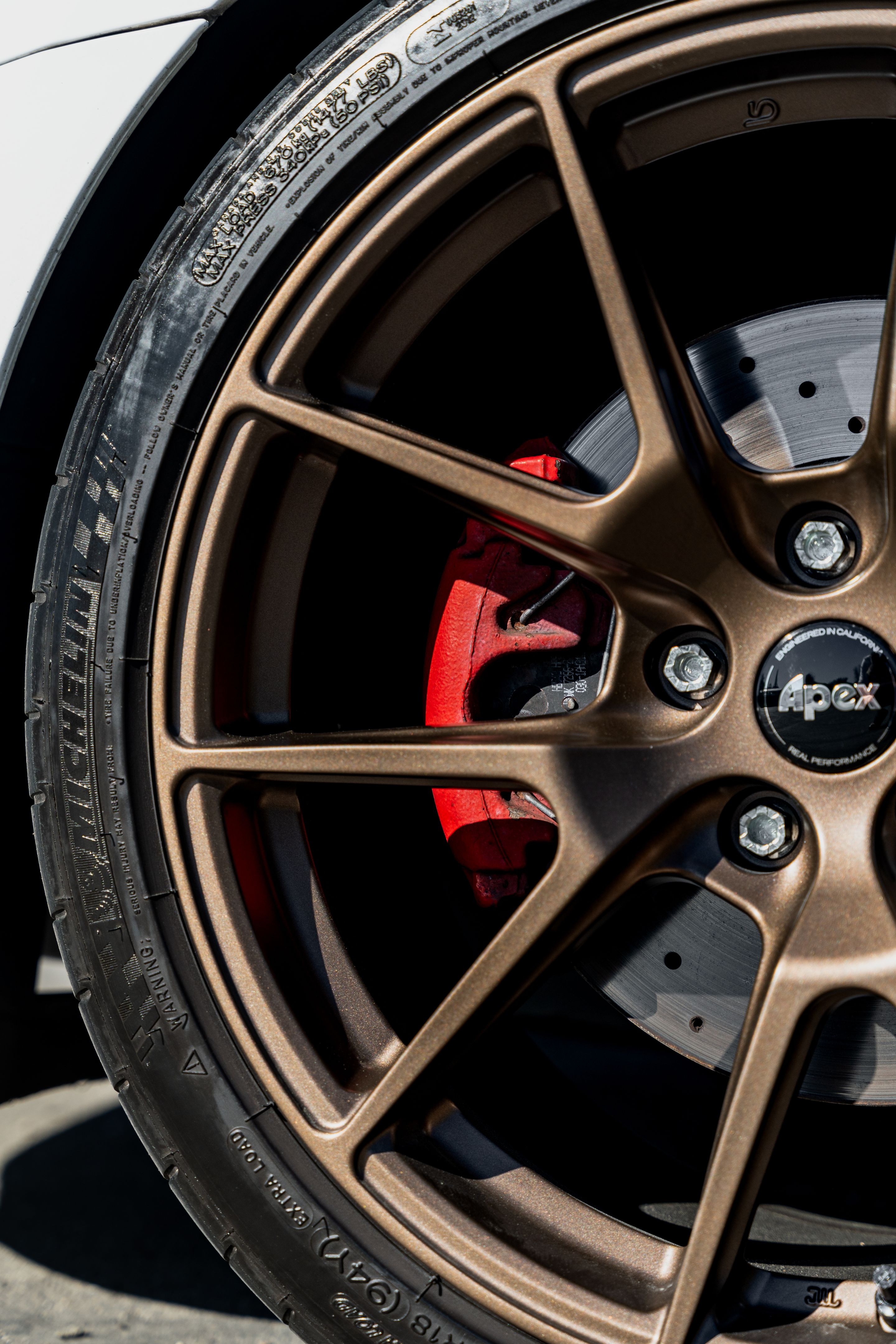 White VW MK6 GTI with 18" VS-5 Apex wheels in Satin Bronze