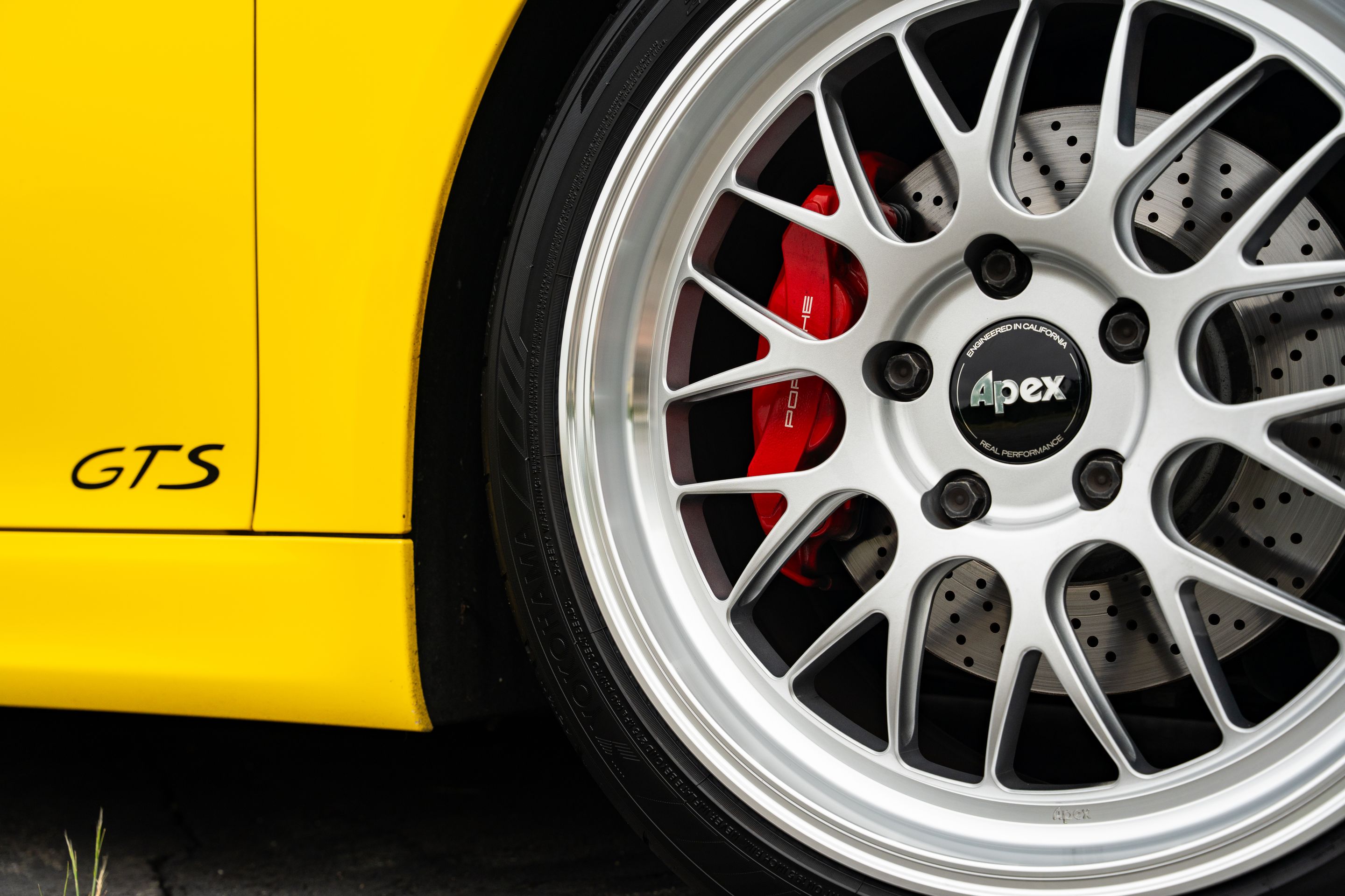 Yellow Porsche 981 Cayman GTS with 19" ML-10RT Apex wheels in Machined Lip Race Silver