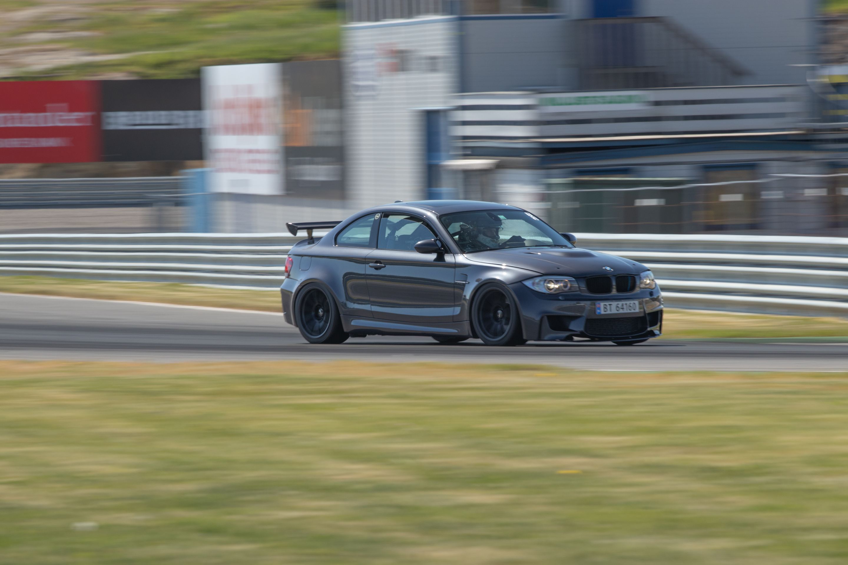 Grey BMW E82 1M with 18" SM-10 Apex wheels in Satin Black