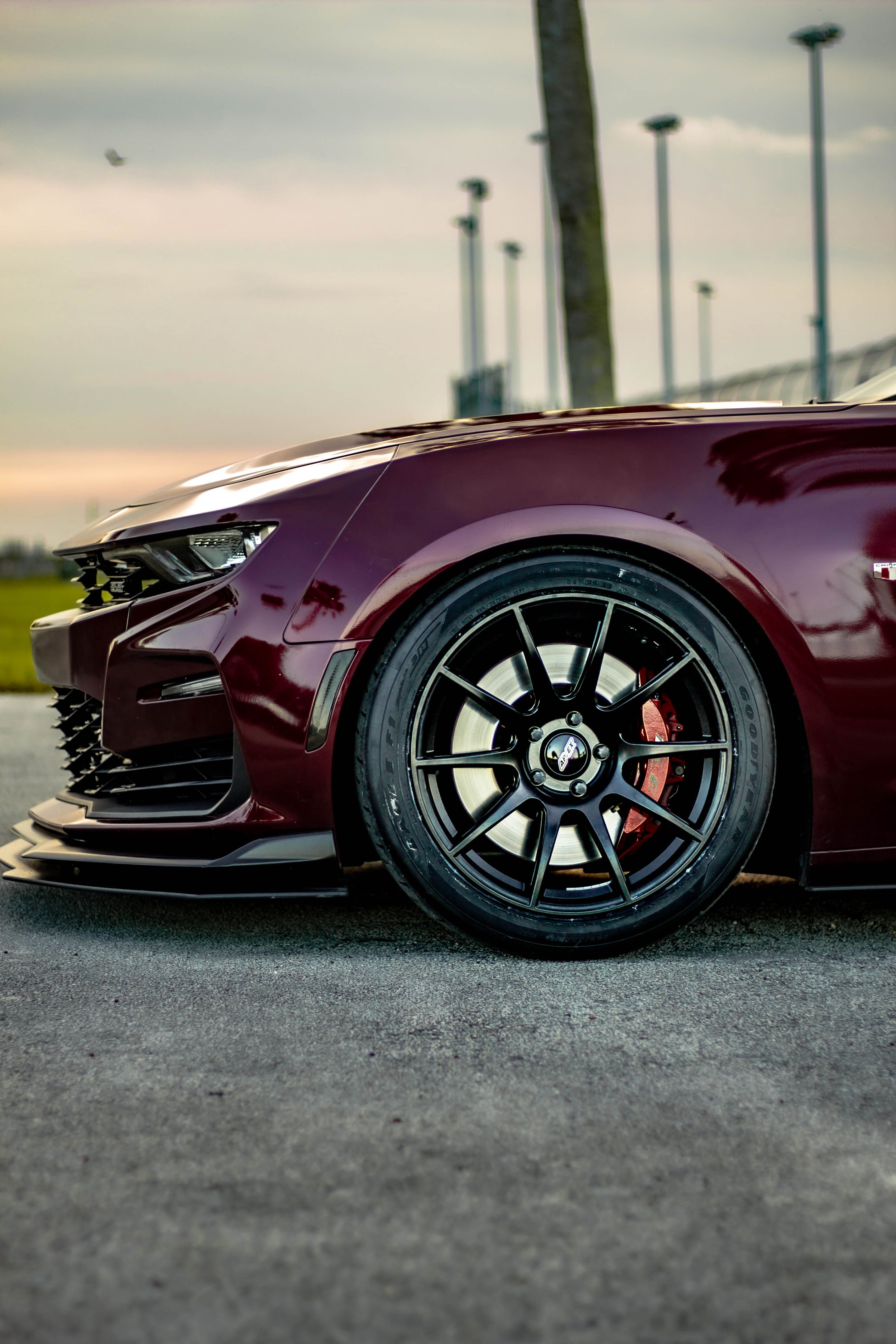 Red Chevrolet 6th Gen Camaro SS with 19" SM-10 Apex wheels in Satin Black