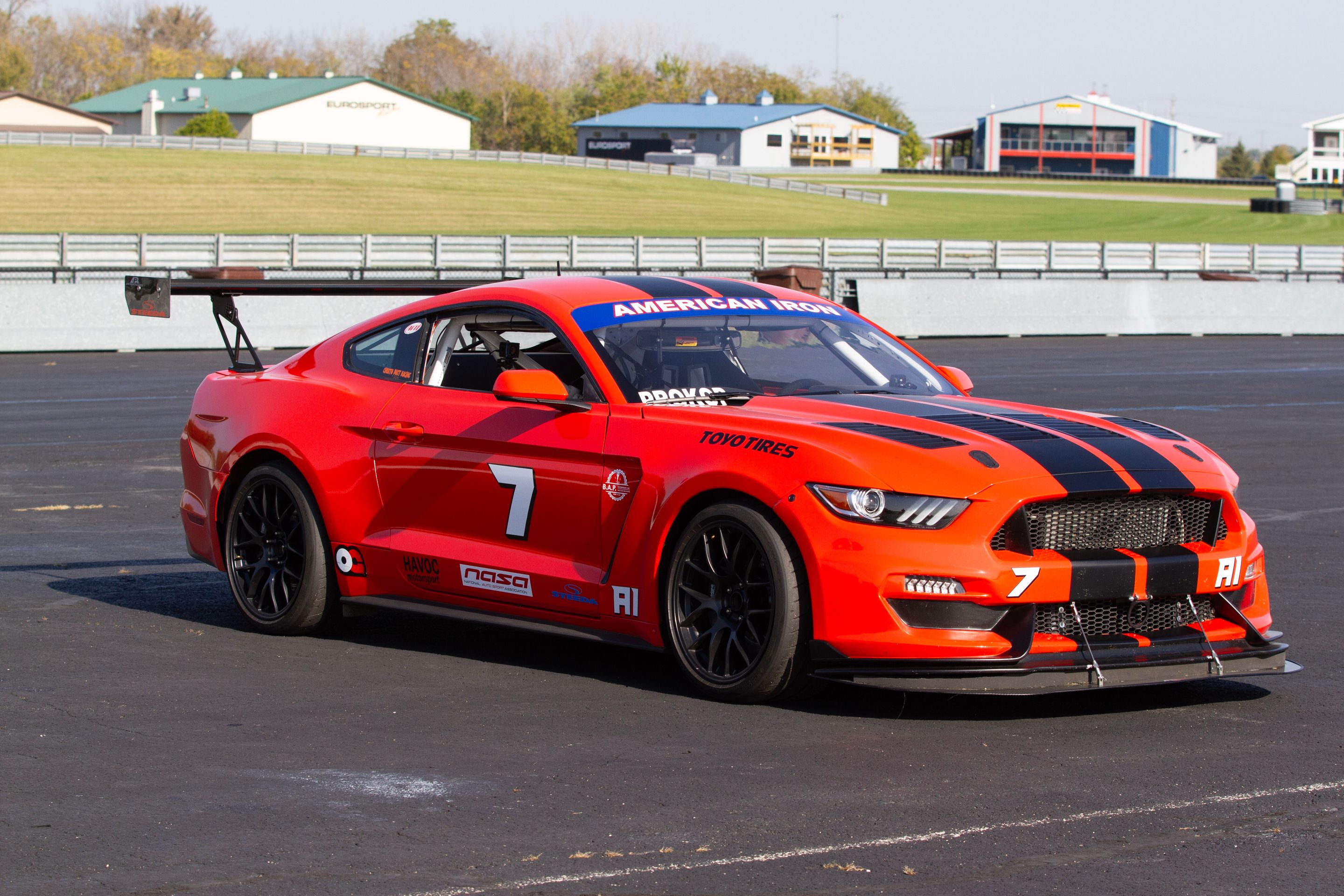 Orange Ford S550 Mustang GT with 18" EC-7 Apex wheels in Satin Black