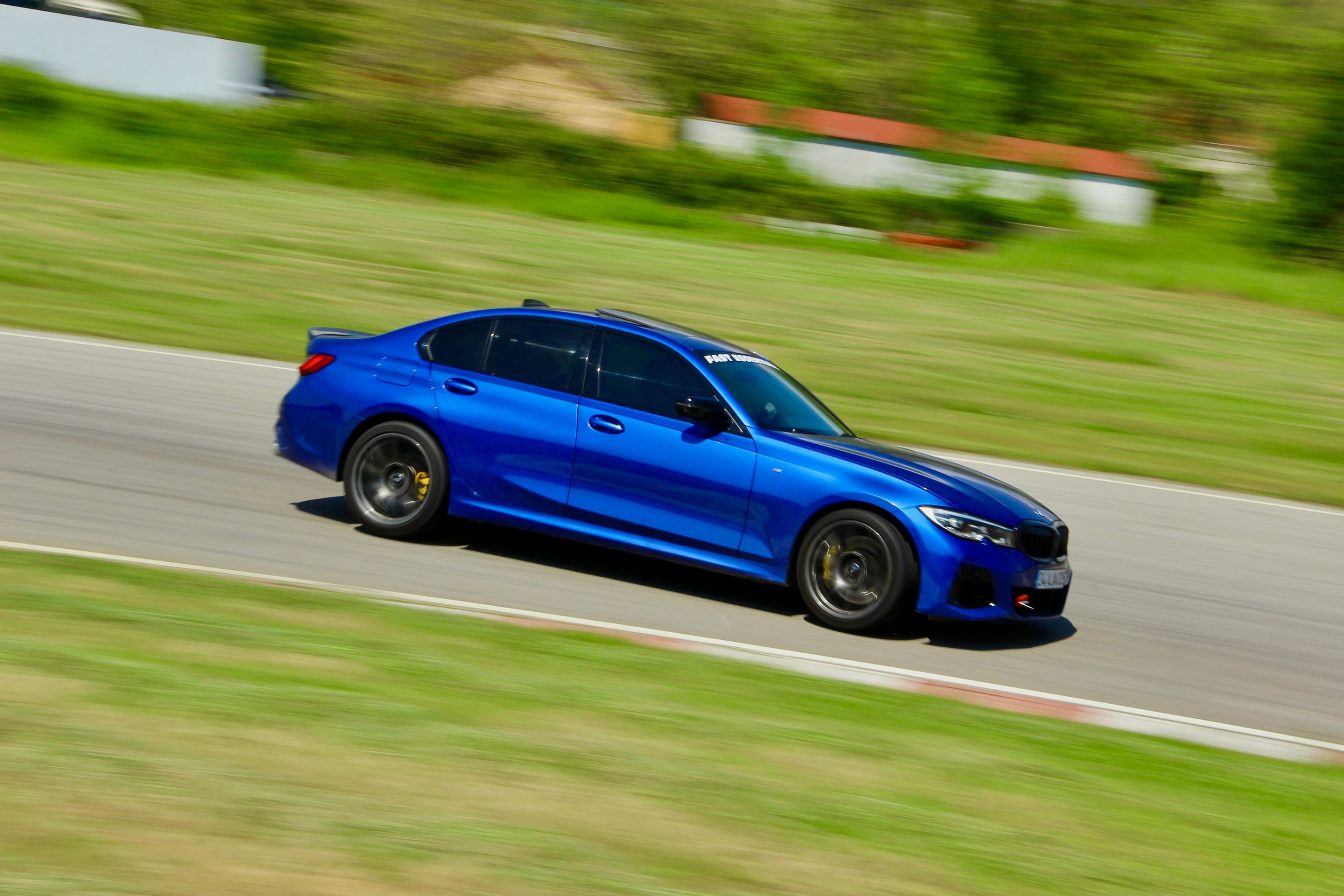 Blue BMW G20 Sedan 3 Series with 19" SM-10 Apex wheels in Anthracite