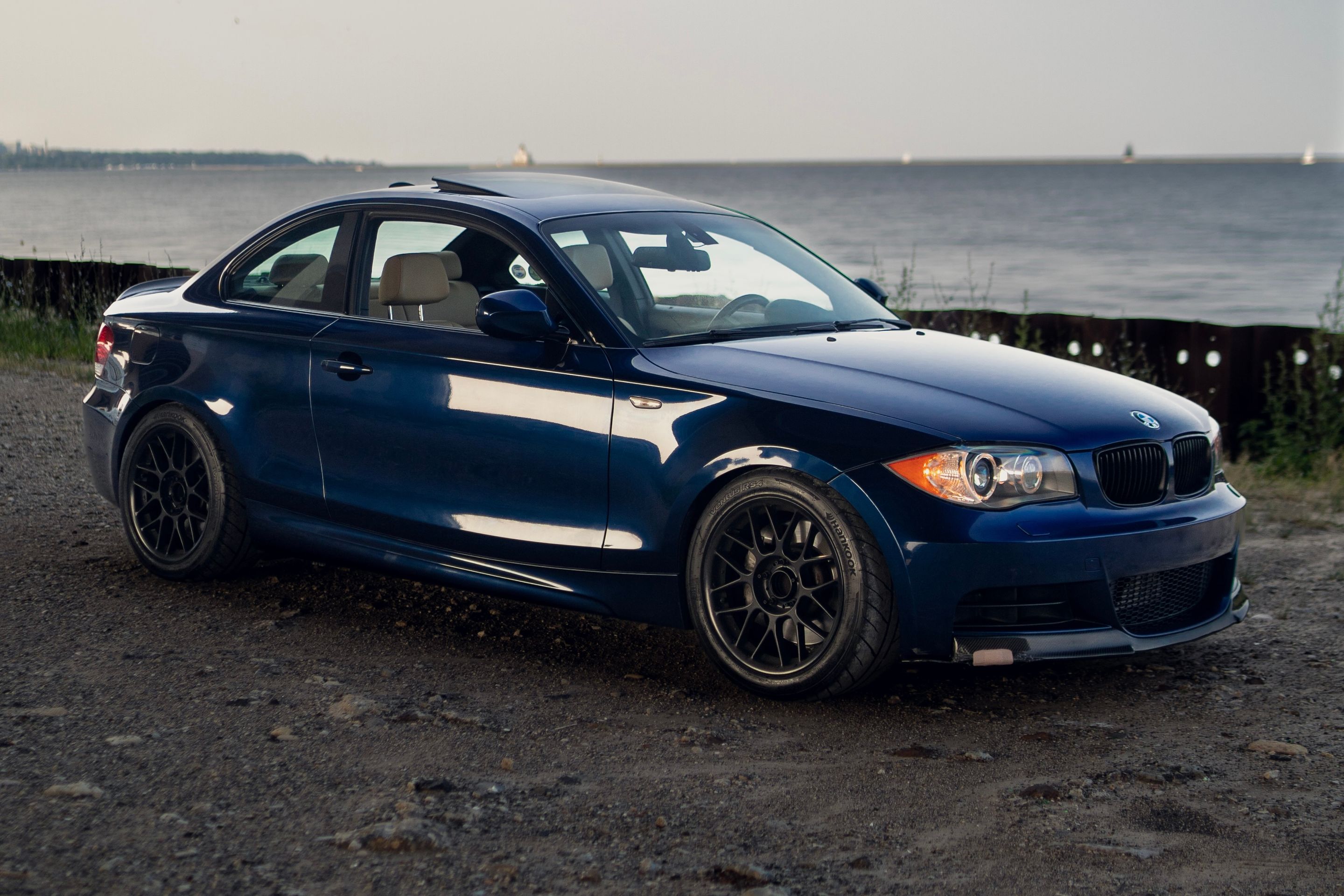 Blue BMW E82 Coupe 1 Series with 17" ARC-8 Apex wheels in Satin Black