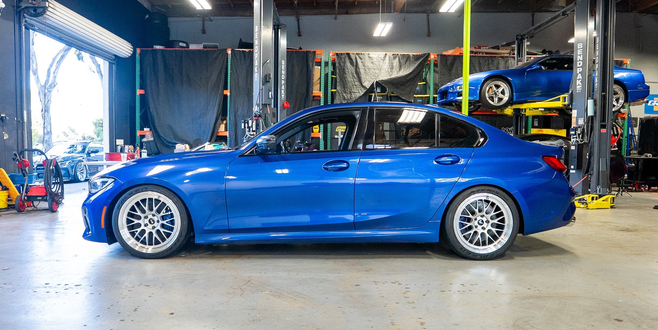 Blue BMW G20 Sedan 3 Series with 19" ML-10RT Apex wheels in Machined Lip Race Silver