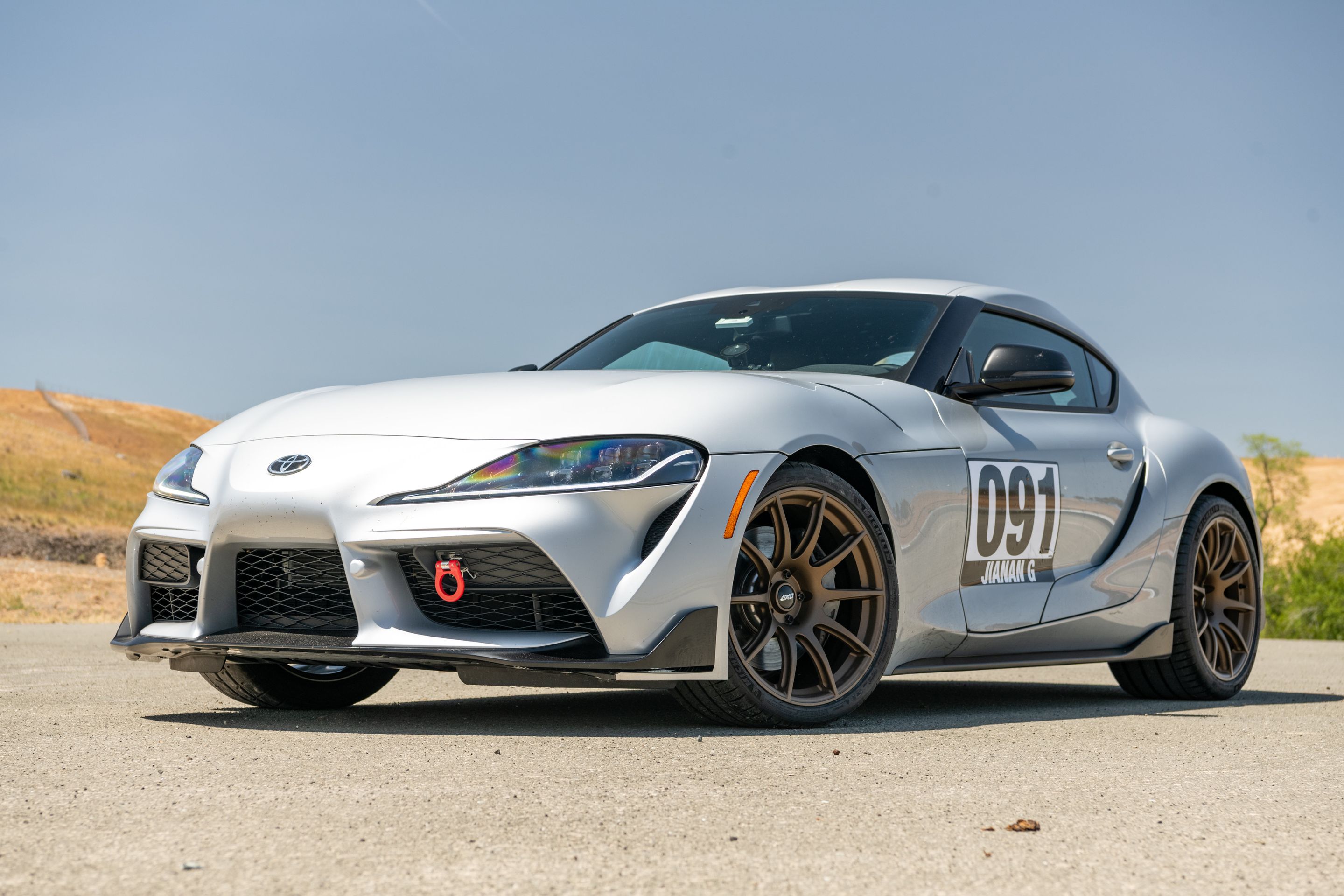 Silver Toyota GR Supra with 19" SM-10 Apex wheels in Satin Bronze